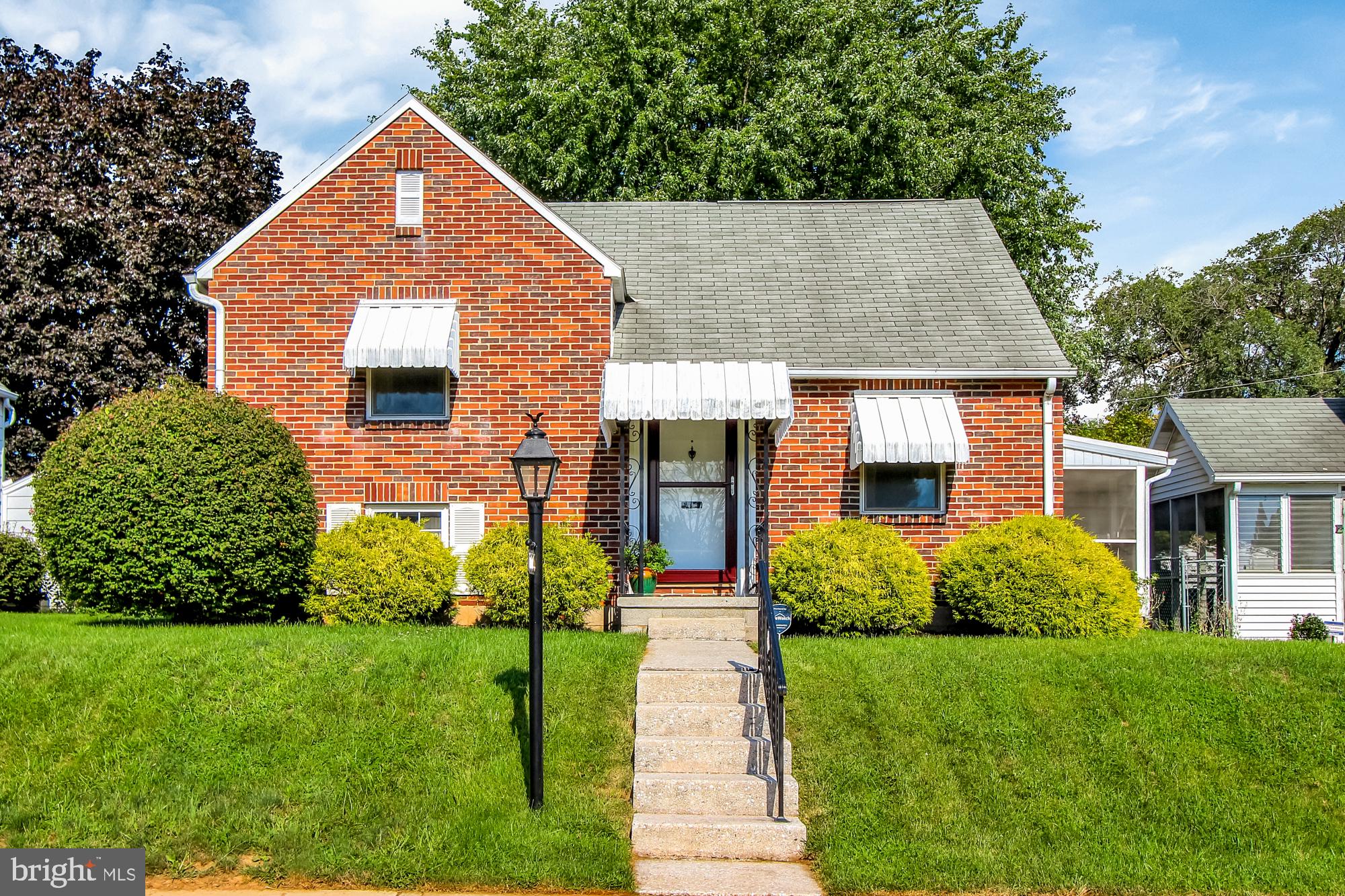 FALL IN LOVE with this beautiful, exceptionally maintained home. Light, bright & filled with charm! Versatile floor plan with living room currently being used as a dining room, refinished hardwood floors & luxury vinyl plank floors, new lighting throughout, kitchen with updated stainless steel appliances, gas range, lower level family room with lots of storage & tons of light, updated bathroom w/new fixtures & tile surround, 3 bedrooms with plenty of space but the cherry on top is the upper level bedroom with barn door, double closets, tons of natural light & more than generous in size. If that's not enough, the huge screened in porch for picnics & barbeques will seal the deal. All with a fenced yard...there's nothing missing in this gem. Everything has been done & it's ready for you to call it home.  New Furnace & central air in 2016 & new rubber roof over screened in porch in July 2020!!