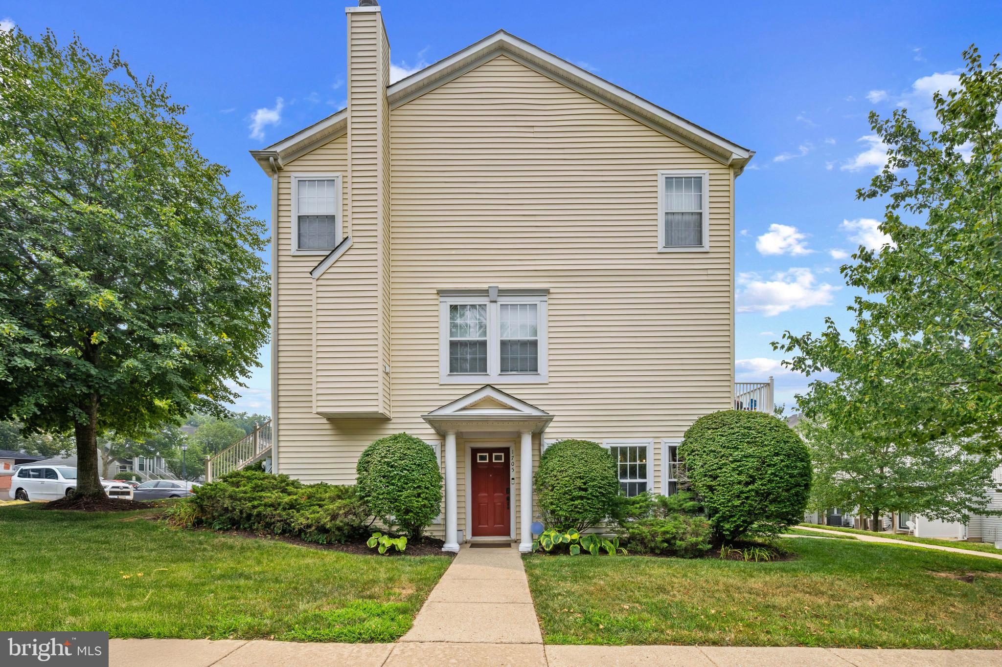 Charming end-of-row Colonial-style townhouse residence offering 2 bedrooms, 2 bathrooms, and 1,204 finished square feet in desirable Cedar Grove at Crofton. // Step inside the thoughtfully designed open-concept main level, beginning with a spacious living room filled with natural light and offering convenient outdoor access. The living room flows seamlessly into the formal dining area, highlighted by a stylish chandelier, classic chair rail detailing, and a convenient closet. // The adjoining eat-in kitchen features two-tone cabinetry, ample countertop space, a pantry, black and white appliances, a breakfast bar, a breakfast area, and a laundry closet, creating a functional and inviting space for everyday meals and entertaining. // The owner's suite offers impressive vaulted ceilings, a spacious closet with mirrored doors, and a private ensuite bathroom featuring beautiful tile flooring, an extended vanity, and a combination tub/shower. A second bedroom and full bathroom complete the main level, with the guest bathroom also showcasing attractive tile flooring. // Step outside to enjoy the quaint outdoor space featuring a patio and thoughtful landscaping, perfect for relaxing. // Residents of Cedar Grove at Crofton enjoy access to community amenities including a swimming pool, common green spaces, and convenient parking lot parking, all within a desirable and well-connected location.