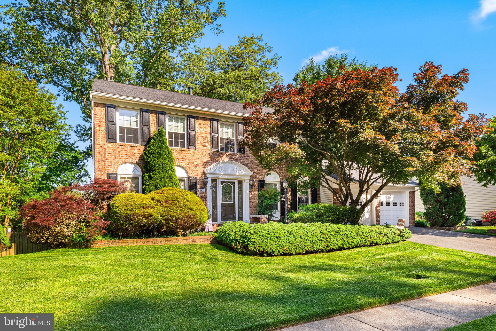 This impressive brick colonial is perfectly sited on a beautifully landscaped and fenced lot featuring a meandering wooden walkway, a spacious multi-level deck with lights, a pond and patio—ideal for outdoor entertaining and everyday enjoyment. The light-filled interior is dramatic, open, and freshly painted throughout. At the heart of the home is the stunning family room with soaring ceilings, skylights, expansive windows and Spanish tile flooring, creating an airy and inviting space. Just off the elegant foyer, a private library with custom built-ins and French doors offers the perfect work-from-home retreat. The renovated kitchen showcases granite countertops, stainless steel appliances, gas cooking, built-in microwave, under cabinet lights, stylish backsplash, and a pantry.  Elegant moldings and recessed lighting add sophistication throughout. With over 3,800 square feet, this home offers generous living space on every level. The decadent primary suite features his and her walk-in closets plus an additional closet, and a luxury bath with an enormous soaking tub, a separate shower and a bidet. The finished lower level provides exceptional versatility, with ample space for recreation (including room for a pool table), a 5th bedroom with walk-in closet, bar with granite counter tops, a large storage room, and a full bath.  Additional special features include; fresh paint on 3 levels plus the garage (2026), new carpet in primary suite ( 2026) ,  new roof (2024), 23 windows replaced, new water heater (2025), added a whole house backup generator, new driveway (2017),  inground sprinkler system, deck 2021, replaced garage doors and openers, and new skylights (2022) . All of this in an unbeatable location just minutes to the Springfield Metro, Burke VRE, Burke Lake Park, South Run Recreation Center, Fort Belvoir, the Pentagon, and a variety of shopping and dining options.