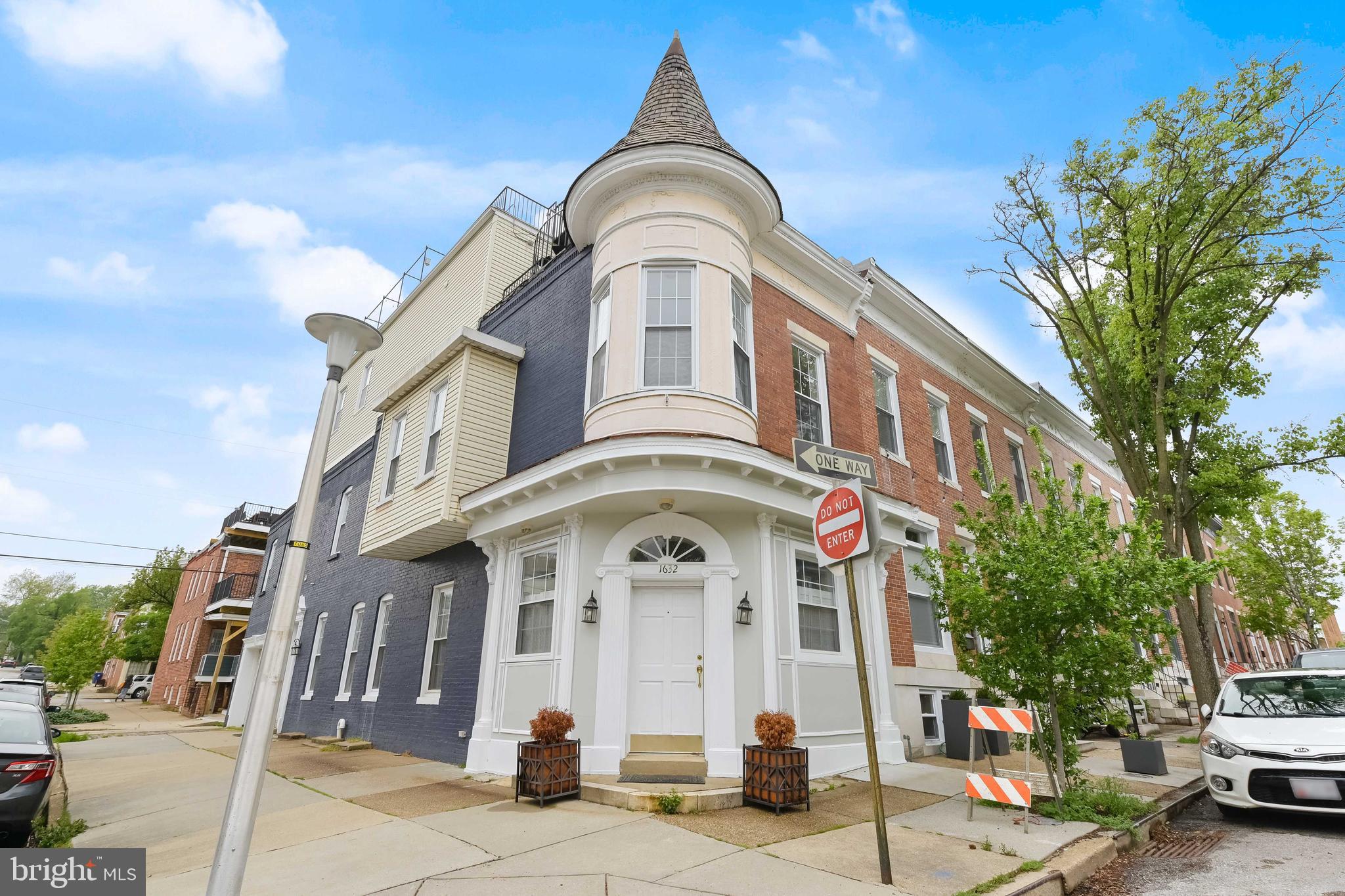 Gorgeous Federal Hill End Unit! This 3 bedroom 2.5 bath home boasts 3000+ finished square feet. Open kitchen/living room area with 42 inch cabinets, stainless steel appliances,  oversized moldings, pendant lights and counter seating for four. Half bath on entry level. Upper level one has 2 good sized bedrooms, 1 bath and a large second family room space. Upper level two can be used as a primary suite. Large bedroom with full bath and walk in closet. Amazing roof top deck with expansive views across the city! Additional living space in finished lower level. This unique property has it all!