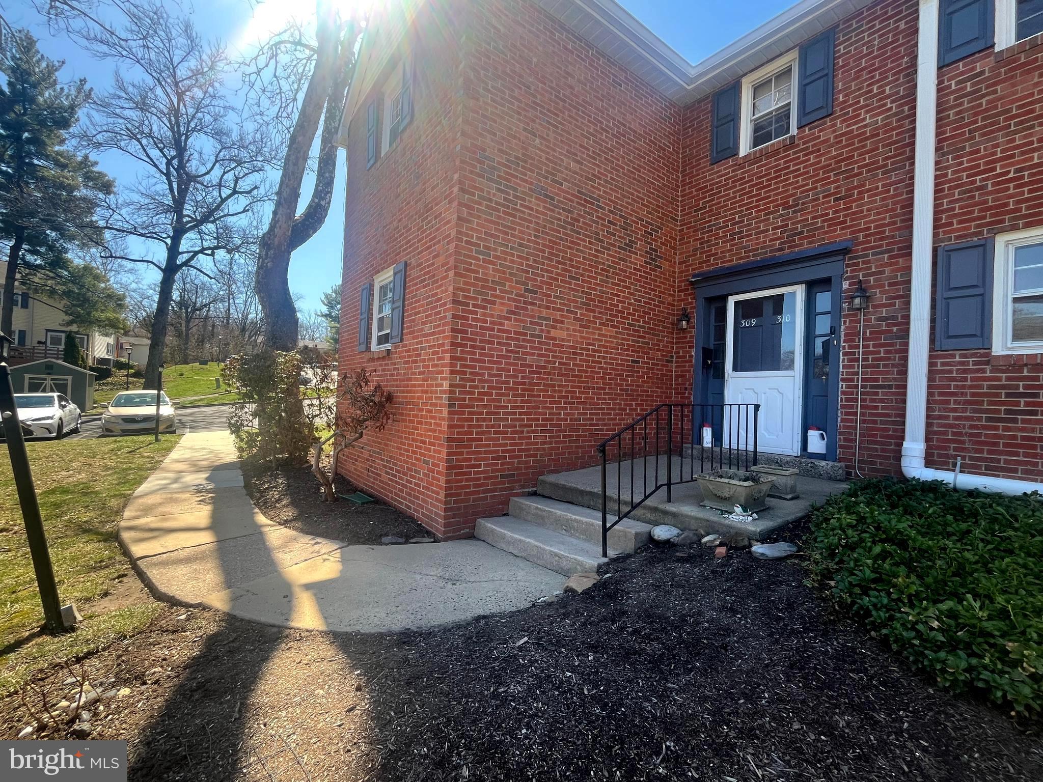 This 1st floor unit is the rare, largest floor plan offered in the complex.  The open living to dining room area  enjoys great light from the french doors to the patio.  There are 3 sizable bedrooms, the primary bedroom with ensuite bath. The  2nd full bath includes a laundry area and there is a large, walk-in storage closet.  The 3rd bedroom is well situated for use as a private office or den as well. The location of this unit gives easy access to parking and only 3 steps up to spacious one level living.  Put your handyman/contractor skills to work to realize the potential of this terrific space and location.  A  2  minute walk to the Septa Train station, or 10 min walk to wonderful Yardley Boro's shops and restaurants.  For nature lovers, there is direct access to the canal tow path.  Being sold as is, renovation is called for.  NOTE: association fees include water and sewer as well as usual maintenance and pool.