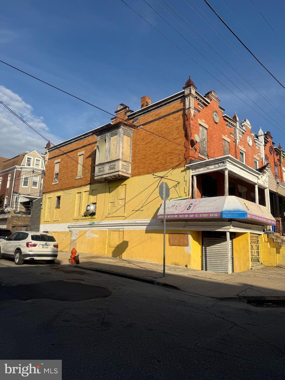 Good opportunity to own this huge three story corner building in Germantown.  All units are vacant and ready for the new owner to give them the needed TLC.  First floor was a grocery store for many years.  Second and third floors are a really good source of income, you can collect around $10,000 a month on the entire property.  Bring an offer and I will present it right away.  CASH ONLY
