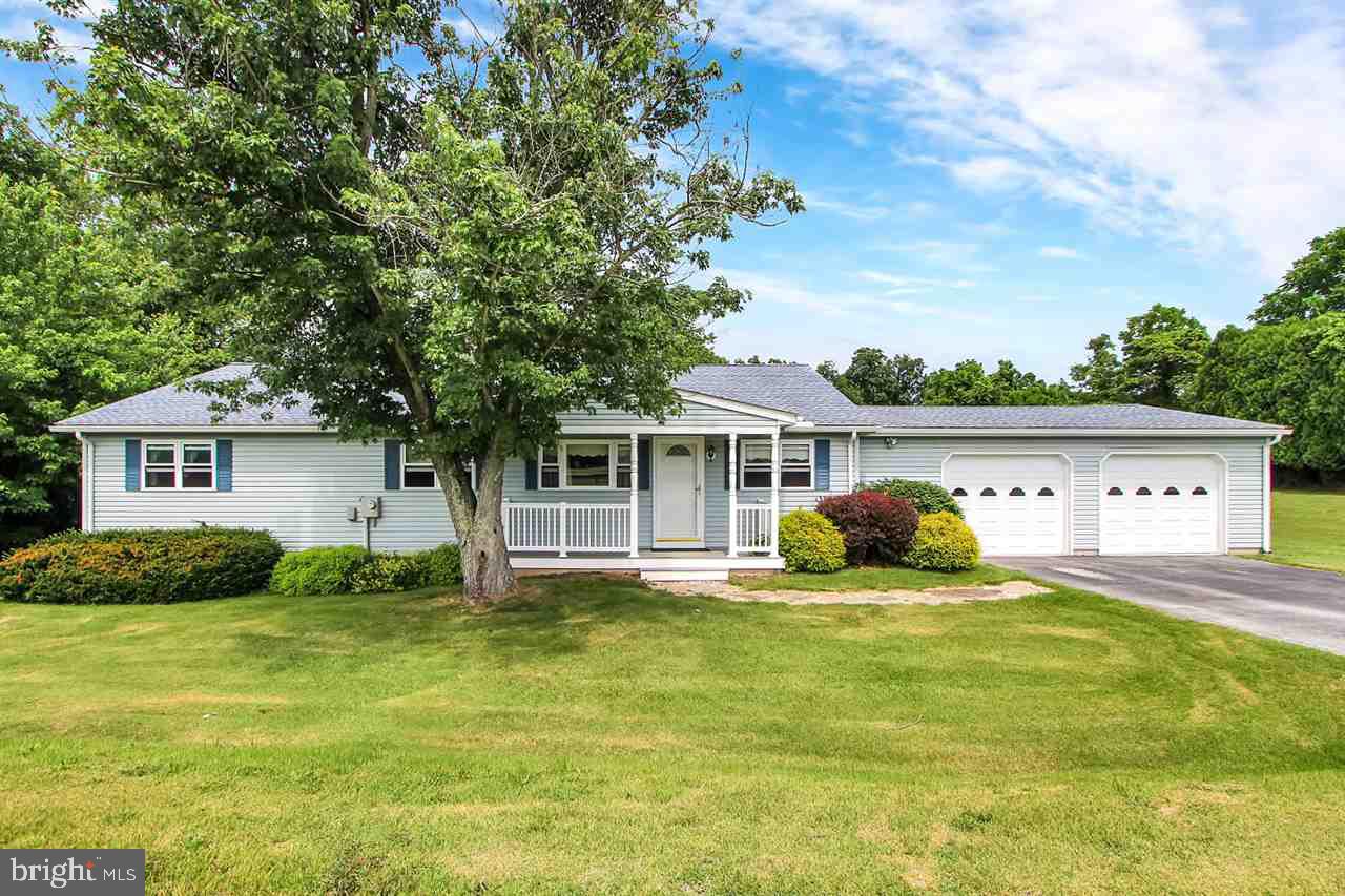 Modular/Manufactured Home With Stick Built Additions. Oak kitchen, microwave, pantry, formal dining room, living room with wood stove, master bedroom with deck access includes a full bath and laundry facility, second bedroom offers a sitting area and deck access, fourth bedroom/den, rear deck 44'x12', over-sized 2-car garage 30'x25', replacement windows, new roof & gutters 2016, lovely private setting borders Middle Creek.