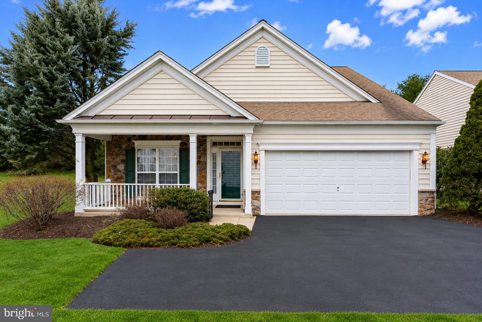 Now offered at $675,000!

Welcome to Traditions at Longwood — one of the area’s most sought-after 55+ communities — where comfort, elegance, and low-maintenance living come together beautifully at 108 Petunia Drive.

This impeccably maintained Cape model offers the ease of first-floor living paired with bright, open spaces designed for both everyday comfort and effortless entertaining. Sunlight pours into the dramatic two-story great room, highlighted by soaring cathedral ceilings and a stunning custom fireplace that creates a warm and inviting focal point.

The open-concept layout flows seamlessly into the spacious kitchen and cheerful sunroom, while the custom stone paver patio provides the perfect setting for morning coffee, outdoor dining, or relaxing evenings with friends.

The private first-floor primary suite features a walk-in closet and a beautifully updated bath with dual vanity and custom tiled walk-in shower. A second main-level bedroom and full bath offer ideal flexibility for guests or a home office.

Upstairs, the versatile loft, third bedroom, and additional full bath create a comfortable private retreat for visitors, hobbies, or extended stays.

Additional highlights include:
Two-car garage,
Large floored attic for exceptional storage,
Thoughtful accessibility features throughout,
Move-in ready condition with tasteful upgrades.

Residents of Traditions at Longwood enjoy resort-style amenities including:
Clubhouses, Swimming pool,
Tennis & bocce courts, Walking trails, Pet-Friendly, Scenic pond and beautifully maintained grounds.

Ideally located just minutes from Longwood Gardens, shopping, dining, and major commuter routes, this home offers the perfect blend of convenience, community, and carefree living.

Don’t miss this exceptional opportunity to own a beautifully upgraded home in one of Chester County’s premier active adult communities.