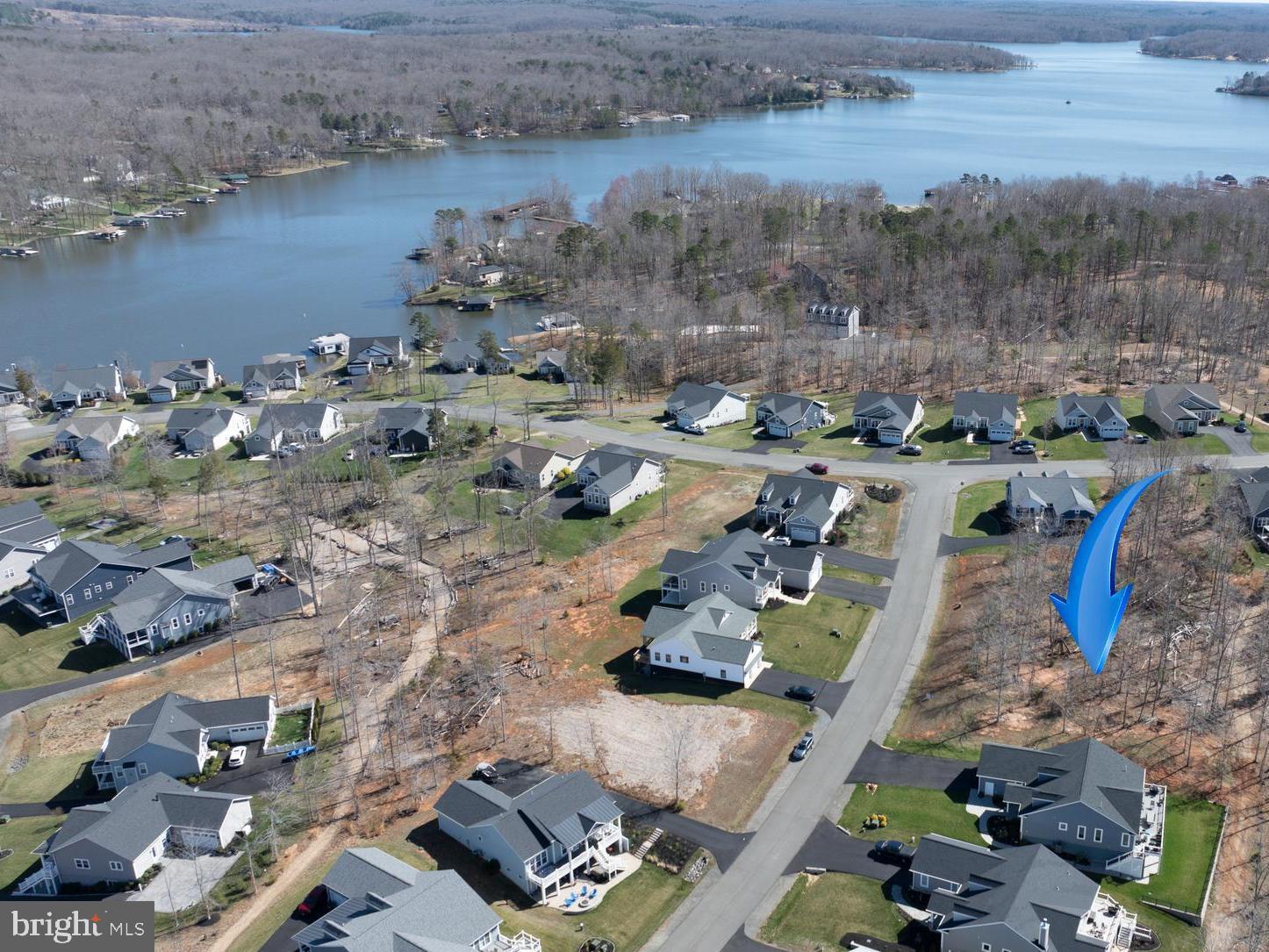 Build your dream home at Lake Anna!  Don't miss this incredible opportunity to create your perfect lake retreat on a beautiful water-access lot, located on the public side of Lake Anna.  This lot includes an assigned COVERED BOAT SLIP (#9 in Boathouse B) and is nestled in the highly sought-after Sunset Cove subdivision.  Lake Anna's only master-planned community.  Just a short walk from the private beach and covered boat docks.  High speed fiber internet is also available within the community.  Sunset Cove stands out with its exceptional amenities, including: a clubhouse with lounge and bar, in-ground saltwater pool, fitness center, disc golf course, hiking and walking trails, boat trailer/RV storage and more.  The HOA takes care of your lawn, so you can fully relax and make the most of your lake days!  With a prime mid-lake location, you’re just minutes from restaurants, shopping, and other local conveniences.  Come explore Sunset Cove and see why this exceptional, close knit waterfront community is unlike any other on Lake Anna.  Fall in love, build your dream, and live the lake life you've always imagined!