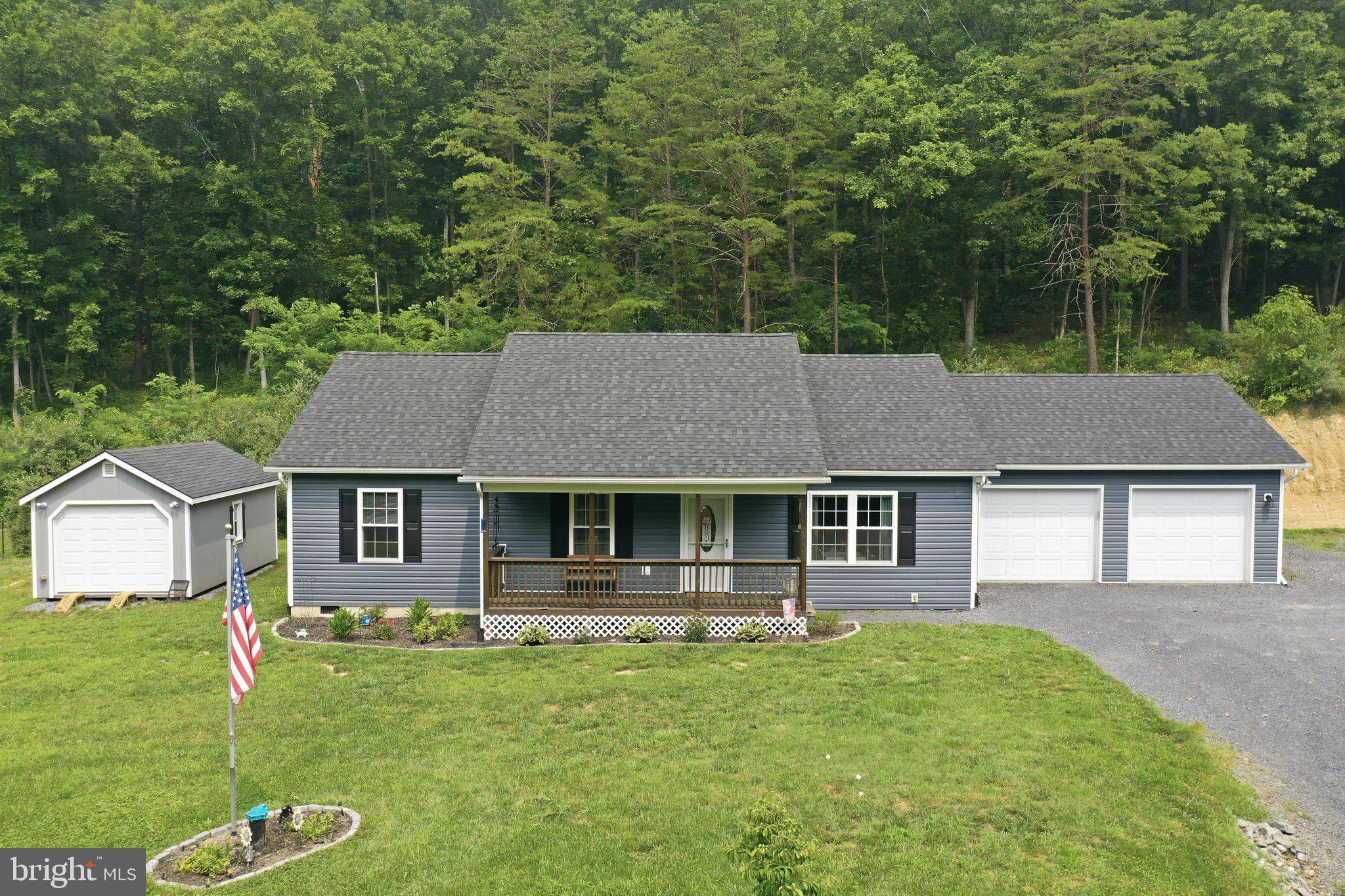 Welcome home to this well-maintained ranch/rambler, offering the convenience of one-level living in a peaceful, private setting. Situated on 1.6 acres, this 3-bedroom, 2-full-bath home features an open and inviting layout with durable luxury vinyl plank (LVP) flooring throughout the main living areas.
The attached two-car garage provides ample parking and storage, while the home's private location backs to woods, offering beautiful natural views and added privacy.  A standout feature is the 12' x 20' outbuilding, complete with a propane wall heater and an electrical panel, both ready to be hooked up—perfect for a workshop, hobby space, or additional storage.  A rare bonus is the additional lot included in the sale, providing extra space and future possibilities. The extra lot includes a well and has a septic letter on file, adding significant value and flexibility for the new owner.  If you're looking for comfortable one-level living with privacy, room to grow, and a unique opportunity with an included additional lot, this property is one you won't want to miss!