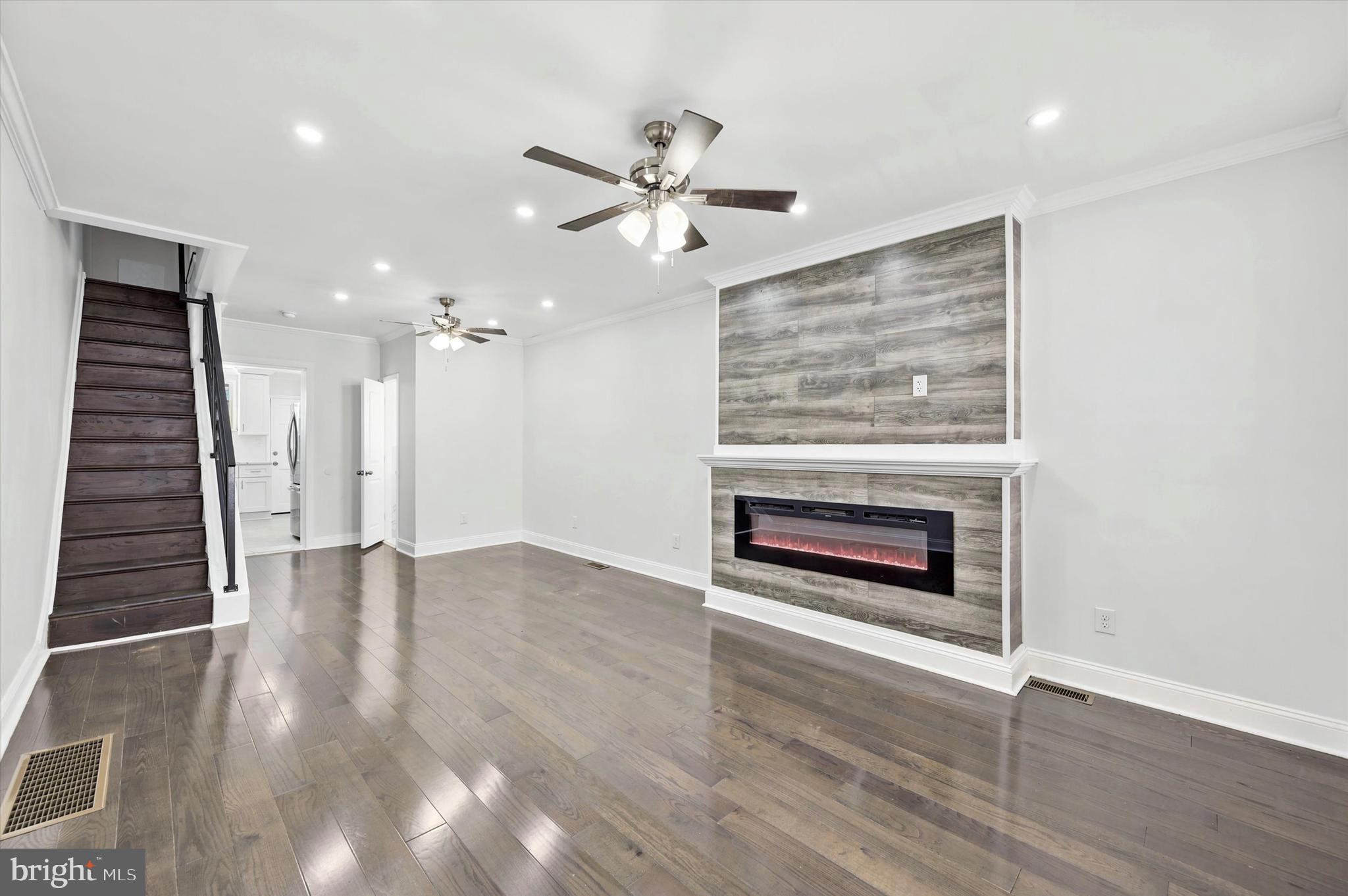 Welcome home to 2241 N Hancock Street a stunning three-story end-of-row townhome in the heart of Norris Square. This tastefully renovated property offers four bedrooms and a total of 1 full bathroom and 2 half bathrooms, ensuring convenience and accommodating your home office needs. The spacious living room, complete with a powder room, is not only inviting but also offers a cozy ambiance with an electric fireplace, perfect for chilly evenings and creating a warm atmosphere. This brand new renovation extends throughout the house, with gleaming hardwood flooring, a sleek stainless steel kitchen equipped with modern appliances, and chic white shaker cabinets for your culinary endeavors. Up the stairs to the second floor, you'll find two good sized bedrooms, providing space to use as bedrooms, office space, playroom and more! Down the hall, discover the epitome of convenience, the full bathroom offers modern features, frameless mirror, and equipped with both a tub with a shower and a separate stall shower. On the third floor, you'll find the third bedroom and the primary bedroom is a private haven, complete with an attached half bathroom. Discover endless possibilities in the partially finished basement – from a workout room to additional storage –  and laundry area complete with laundry*. Located just a block from the Norris Square park, and one block from the York-Dauphin station, enjoy the neighborhood amenities from shopping, to eating, entertainment and more, this home combines the charm of a dynamic neighborhood with the tranquility of your private oasis.