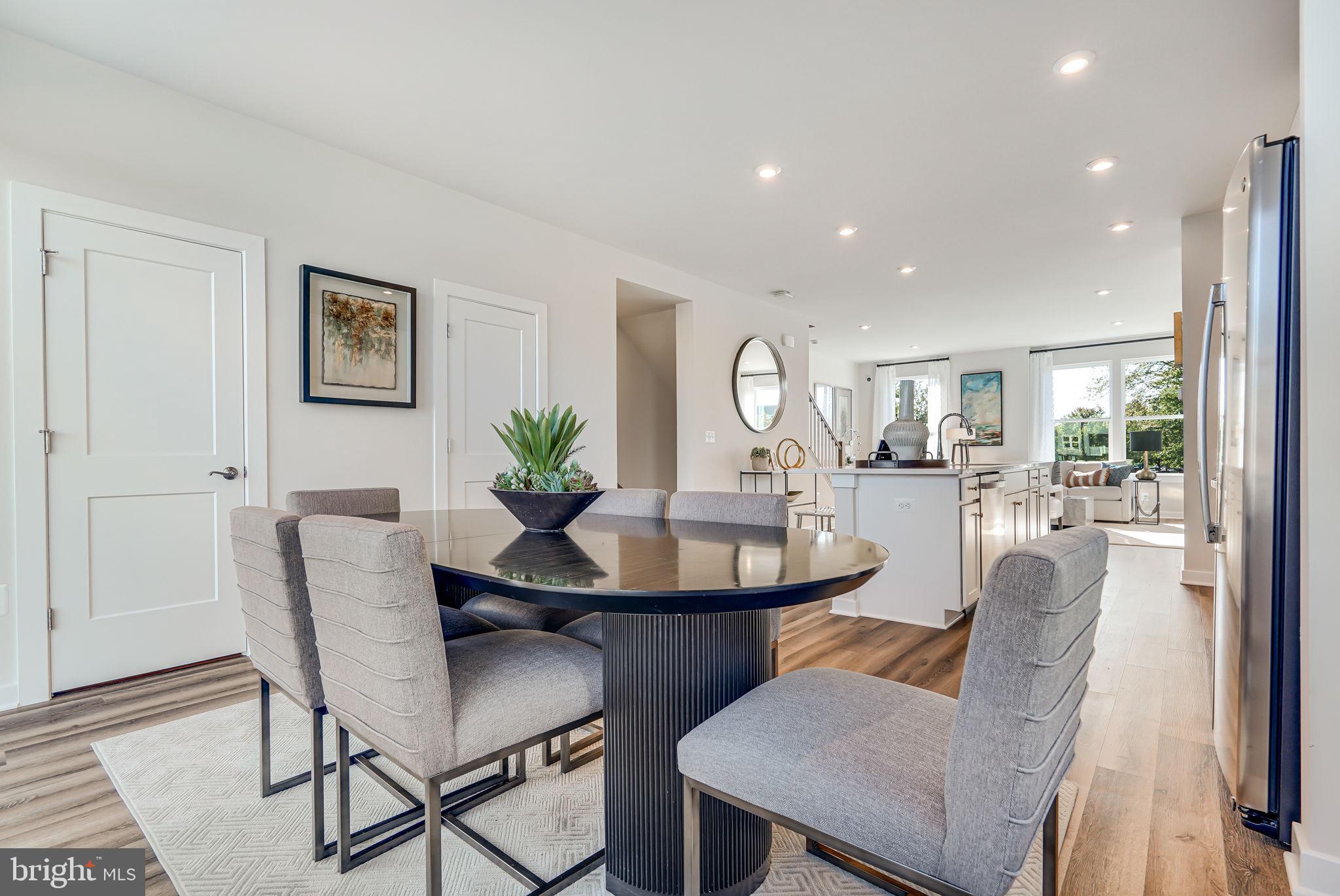 Brand new Stanley Martin 3-level garage townhome at The Woodlands!
This is a home that lends itself to both entertaining and intimate gatherings. Greet guests in the foyer
before heading up to the open-concept main level. You'll agree, this is the place for everyone to gather! The gourmet kitchen with a large sit-down island is the center of attention with plenty of room for the home chef and food enthusiast alike. The kitchen is open to a large family room and dining area which makes this space feel complete. After the fun, retreat to your primary suite with a private en suite bath and spacious closet. This room may become your favorite and will certainly inspire you to put your feet up and relax. Down the hall, two additional bedrooms with a full bathroom offer comfortable options for friends and loved ones. There's plenty of flex space to create a home that will complement your lifestyle! Turn the lower level bedroom into a guest suite,  home office, gym, or playroom for the kids! Picture having your morning coffee on the rear deck before the day is underway, or perhaps an evening cocktail to unwind. Photos are of a similar home.  Contact us to schedule a tour or stop by and visit our model home today.

At The Woodlands, enjoy brand-new future amenities dispersed throughout the neighborhood, including several parks, a meadow trail, and outdoor gathering space with an area for lawn games. With an array of shopping and dining options just minutes from your doorstep and quick access to US-301 and Branch Avenue, you'll love the location and convenience The Woodlands offers. Visit us today!
