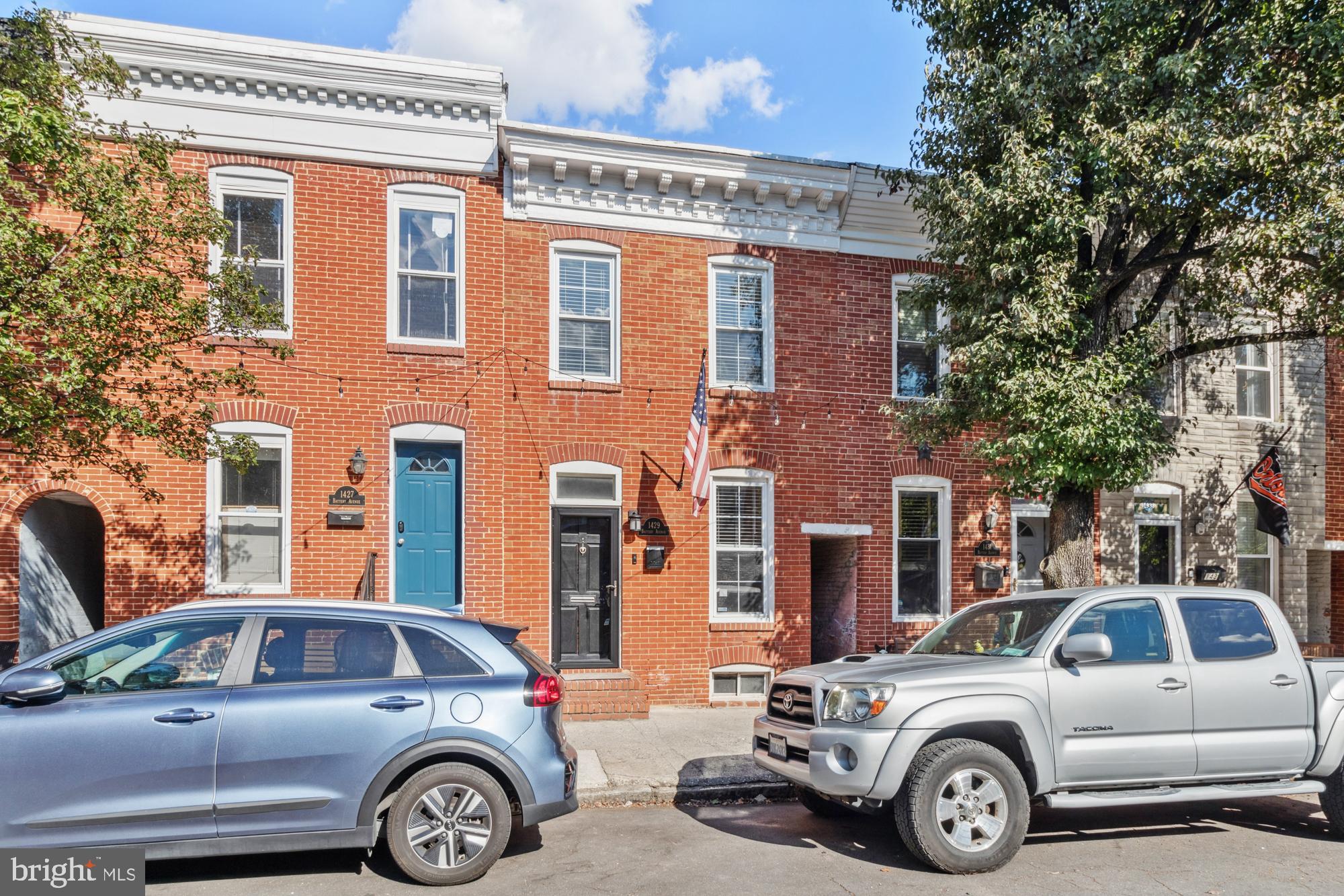 Welcome to 1429 Battery Avenue, a beautifully maintained 2-bedroom, 2.5-bath rowhome in the vibrant Federal Hill neighborhood. This home offers refined living with a practical layout, including a convenient parking pad and a stunning two-tiered rooftop deck. Enjoy a spacious open-plan living area leading to a gourmet kitchen with stainless steel appliances, granite countertops, and abundant cabinetry. The main level also features a mudroom/laundry and a half bath. Upstairs, find two generously sized bedrooms each with en-suite bathrooms and ample closet space. The highlight is the brand new rooftop deck, perfect for entertaining while taking in stunning city views. Situated just blocks from Cross Street Market, Riverside Park, and Federal Hill Park, with quick access to I-95.