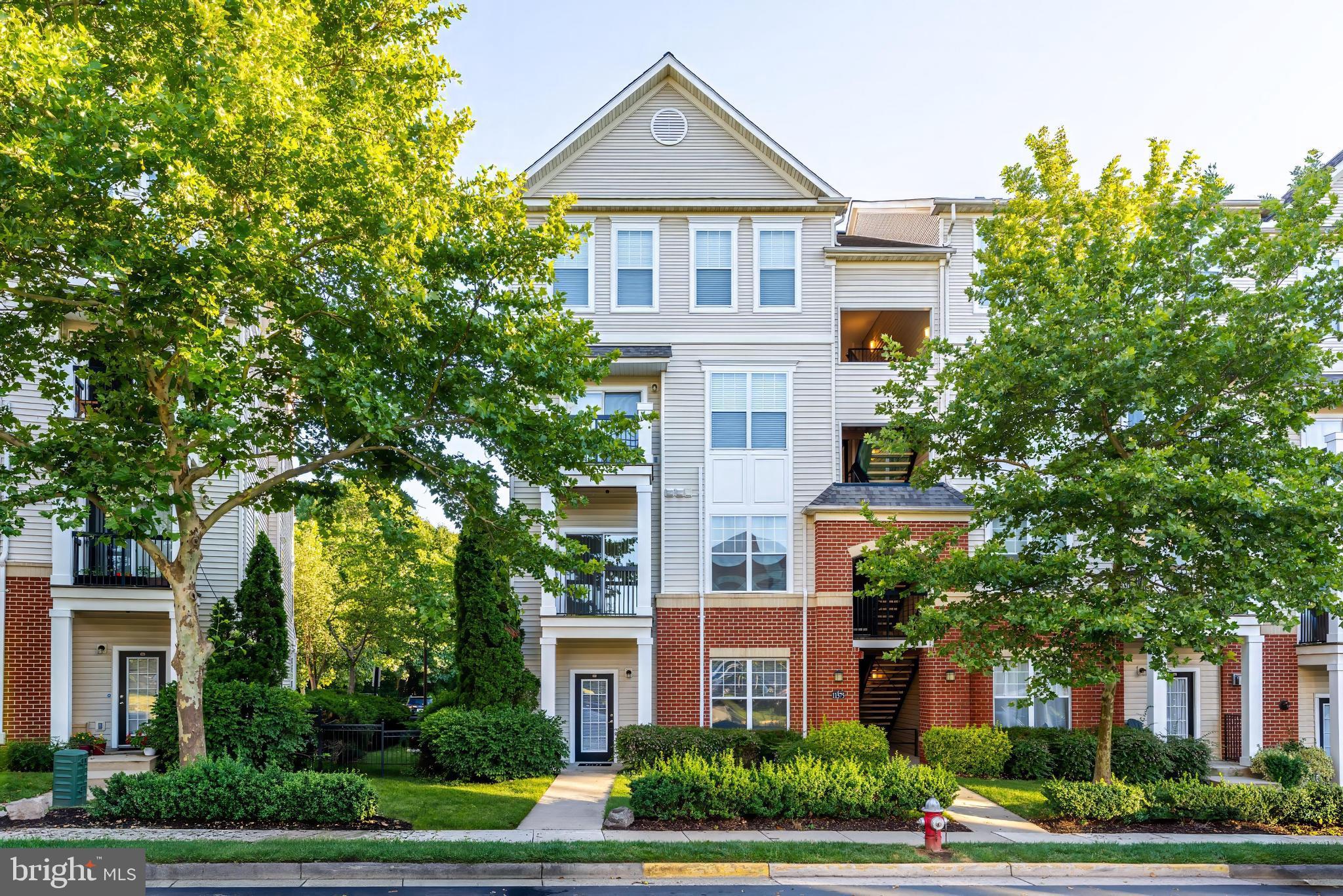 Stunning, sun-drenched end-unit condo in the highly sought-after Fairfax Ridge community! Boasting a rare, highly functional floor plan spanning 1,324 square feet, this exceptional main-level residence features 2 spacious bedrooms and 2 full bathrooms, seamlessly blending contemporary comfort with ultimate suburban convenience. Step inside through your private front door entrance to discover a spacious, open-concept main level living environment featuring a ceramic-tiled entrance , fresh neutral paint, and pristine  new carpeting. The bright living area flows effortlessly into a gourmet kitchen with new  countertops and a distinct dining zone—perfect for entertaining. Remote workers will love the dedicated, built-in computer nook area  or main level bonus room  great for den or study. while both good size bedrooms serve as private retreats featuring their own expansive walk-in closets. A huge added bonus: this unit features a highly coveted attached 1-car garage an extra parking pad/driveway space PLUS an assigned parking space bypassing standard condo parking constraints! Freshly  painted garage plus beautiful new epoxy floor! Live the resort lifestyle with unparalleled community amenities including an outdoor swimming pool, a fully equipped fitness center with a yoga studio, a clubhouse game room, playground, and a business center. An absolute commuter’s dream location—situated mere seconds from I-66, Route 50, and Route 29, with easy transit access to the Vienna/Fairfax-GMU Metro Station. Walk to nearby retail or enjoy a 5-minute drive to premier lifestyle destinations like Fair Oaks Mall and Fairfax Corner. Zoned for highly rated Fairfax County Public Schools (Waples Mill ES, Franklin MS, Oakton HS). WHEN YOU TURN ONTO FAIRFAX RIDGE GO STRAIGHT THE TOWNHOUSE STYLE HOME FRONTS ON FAIRFAX RIDGE GARAGE IS ON ARISTOTLE