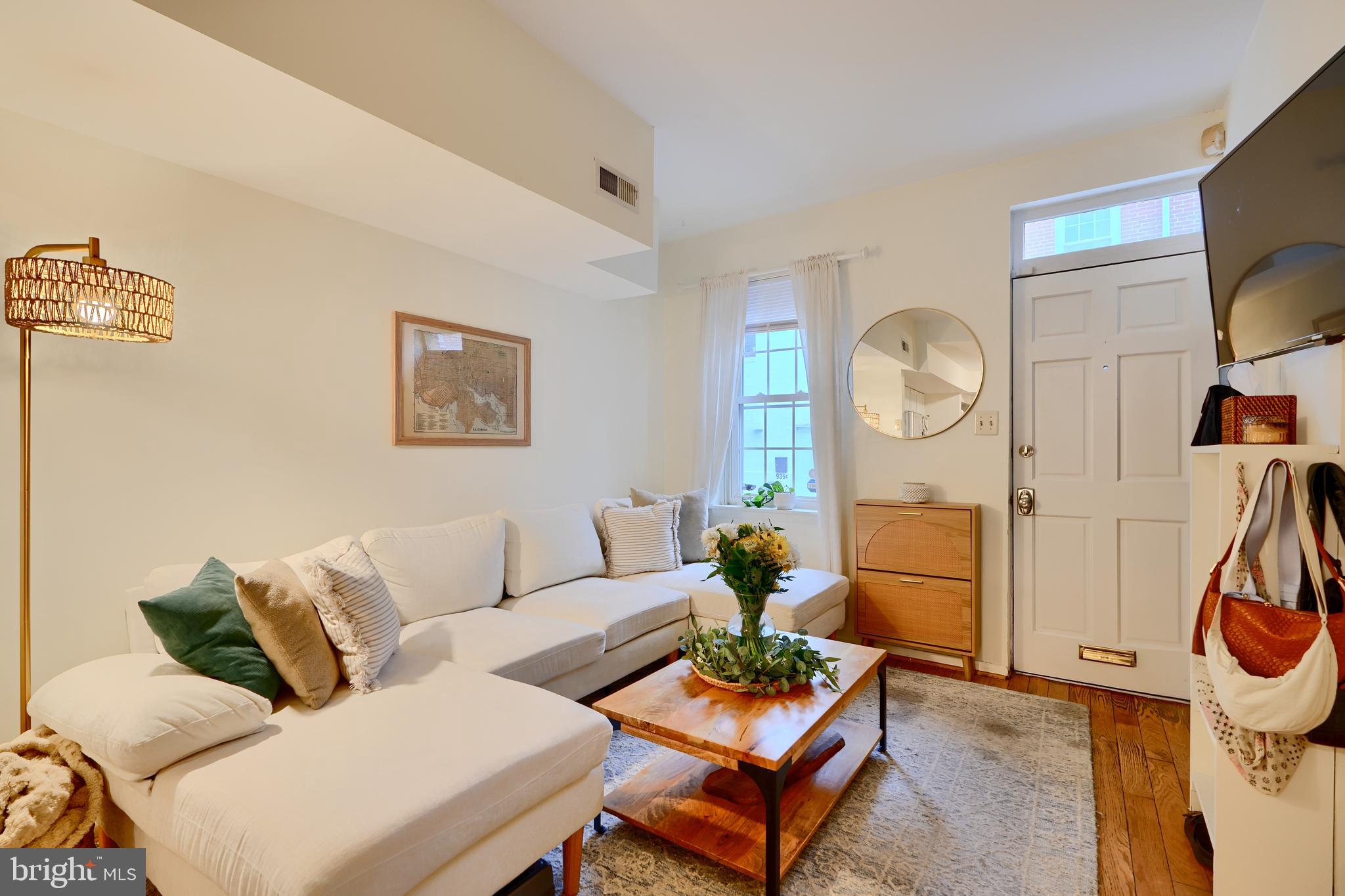 Nestled on a charming pedestrian street, this jewel box home offers the perfect blend of character and modern convenience.  This sweet one bedroom plus den residence features beautiful wood floors, vaulted second floor ceilings, and abundant natural light. The renovated full bath showcases stylish finishes, while the centrally located kitchen boasts butcher block countertops, subway tile, and an adjoining breakfast room ideal for casual dining.  The versatile second floor den is perfect for a home offer, yoga space, or personal retreat.  Additional highlights include central air, in unit washer and dryer, and access to a shared rear courtyard with space for grilling and container gardening.  Ideally located just steps from neighborhood restaurants and boutiques, with an easy walk to M &T Bank Stadium and Oriole Park at Camden Yards.