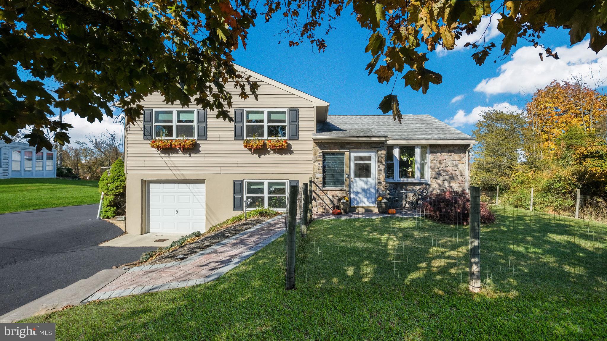 Explore an exceptional opportunity just north of Doylestown, where residential comfort seamlessly integrates with entrepreneurial potential. This unique property features a charming split-level home alongside a versatile 2,200 square foot commercial building, offering a multitude of possibilities. The updated split-level home exudes warmth and functionality, perfect for those seeking adaptable living spaces. Enjoy beautifully maintained hardwood floors throughout the main and upper levels, enhanced by a modernized kitchen, renovated main bath, and upgraded six-panel wood doors. Recent improvements include newer siding, gutters, roof, and windows, ensuring long-term peace of mind. Relax in the enclosed three-season porch, ideal for savoring serene views of the expansive backyard. The home also includes an attached one-car garage for added convenience during inclement weather.

The property's standout feature is the impressive detached shop building, previously used as a motorcycle shop, dance studio, and most recently, a plant store. This versatile space offers endless business or personal use possibilities, complete with an ADA-compliant powder room and a full three-piece bath in the back storage area. Zoned C2 for commercial use, potential buyers should verify allowable uses with the township. A commercial mortgage loan will be required for this property.

Situated on just over an acre within the highly acclaimed Pennridge School District, this property also includes a mini barn, adding to its charm and utility. Its prime location offers both convenience and tranquility, with easy access to local amenities and a short drive to Doylestown. Don't miss the chance to explore this unique property-schedule your private tour today. Additionally, this property is listed as commercial under MLS# PABU2101870.