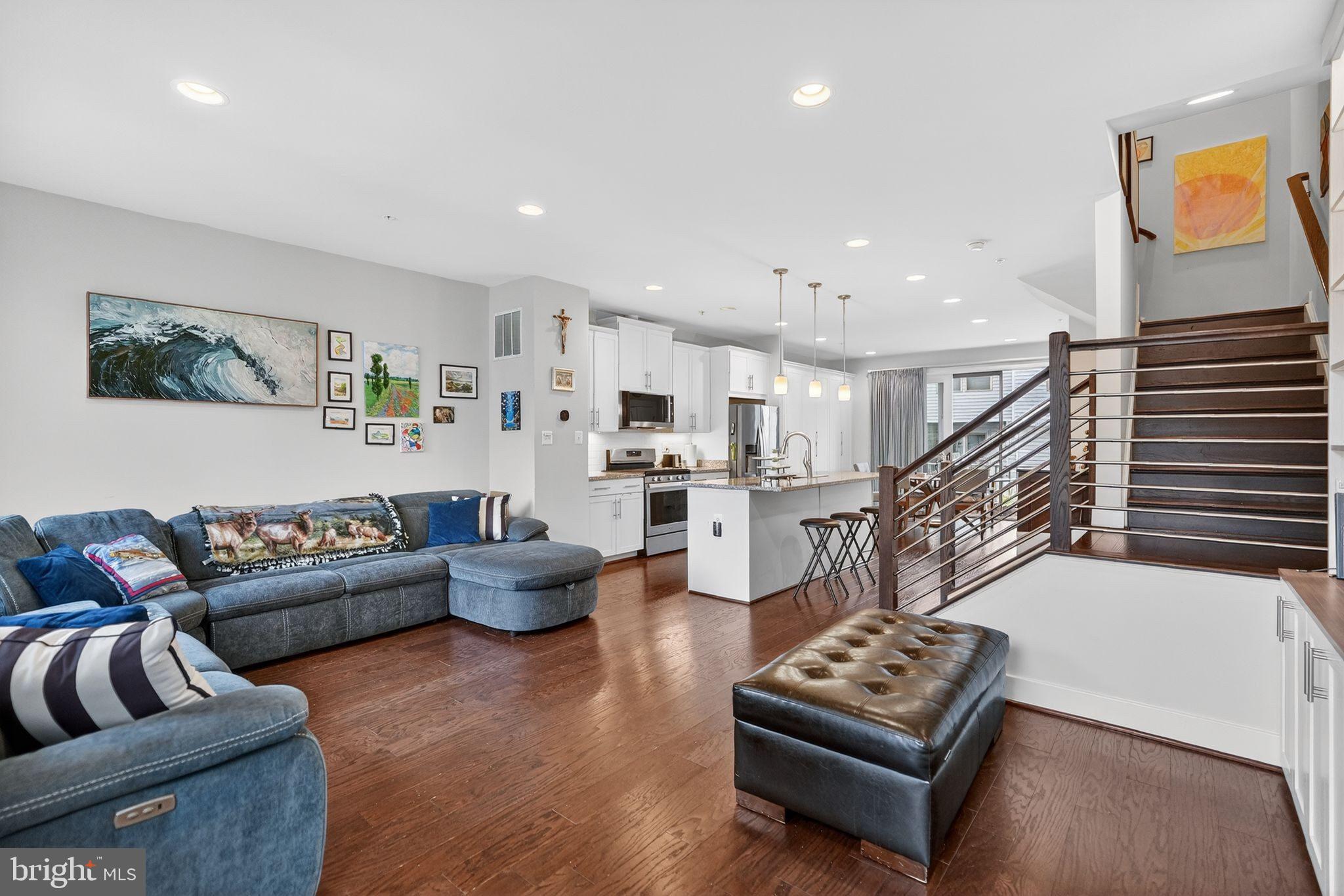 OPEN SUNDAY (5/31)  2:00 PM -  4:00 PM.

JUST REDUCED.  Four true bedrooms!  Luxurious and sophisticated, this 6 years young 3 story townhome offers a great location close to Metro, major transportation routes and many amenities. 

Gourmet chefs looking for the perfect kitchen will find it in the granite and stainless kitchen with its abundance of cabinet and counter space. Serve morning coffee at the center island while the dining area is perfect for more formal meals. Either way, the natural light, high ceilings with recessed lighting, and open concept offer ambiance and relaxation. A powder room is conveniently located on this level. 

The primary bedroom includes a large, customized walk-in closet with built-ins, as well as open shelving, and the sumptuous primary bathroom has a built-in bench in the shower and double sinks. The 2 additional bedrooms, one with a walk-in closet and the second with a double closet, a second full bathroom, and laundry complete this level. The fourth bedroom with an ensuite full bath is located on the entry level and also could be a multi-purpose room, family room or home office.Hardwood floors, neutral decor and six panel doors are some of the fine features, and a deck and 2 car garage with EV charger complete this picture perfect home.  A few steps away is the playground/tot lot.