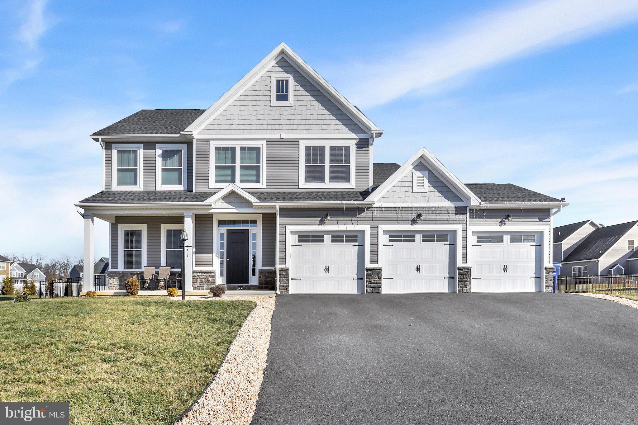 Built in 2021 and thoughtfully designed for today's lifestyle, this beautifully maintained home in Grand Point Crossing offers over 2,600 square feet of living space, a three-car garage, and a nearly half-acre lot.

Step inside to a bright, welcoming living room before entering the heart of the home, where the open-concept kitchen, dining area, and family room come together to create a space that's perfect for everyday living and entertaining. The kitchen is sure to impress with abundant cabinetry, generous counter space, a large center island, and plenty of room to gather with family and friends. Whether you're preparing dinner, helping with homework, or hosting the holidays, this layout keeps everyone connected.

Upstairs, all four bedrooms are conveniently located on the same level, along with a dedicated laundry room for added everyday convenience. The spacious primary suite offers a relaxing retreat with a tray ceiling, crown molding, a walk-in closet, and a private bath featuring a soaking tub and an oversized tiled shower with dual shower heads.

The outdoor space is just as inviting. Step through the dining area to the fully fenced backyard, offering plenty of room for pets, play, gardening, or simply enjoying time outdoors. The full unfinished basement provides endless possibilities for future living space, whether you envision a home gym, recreation room, media room, or additional storage.

Located in the Chambersburg Area School District and just minutes from shopping, dining, and Interstate 81, this move-in-ready home offers the space, comfort, and modern conveniences today's buyers are looking for.