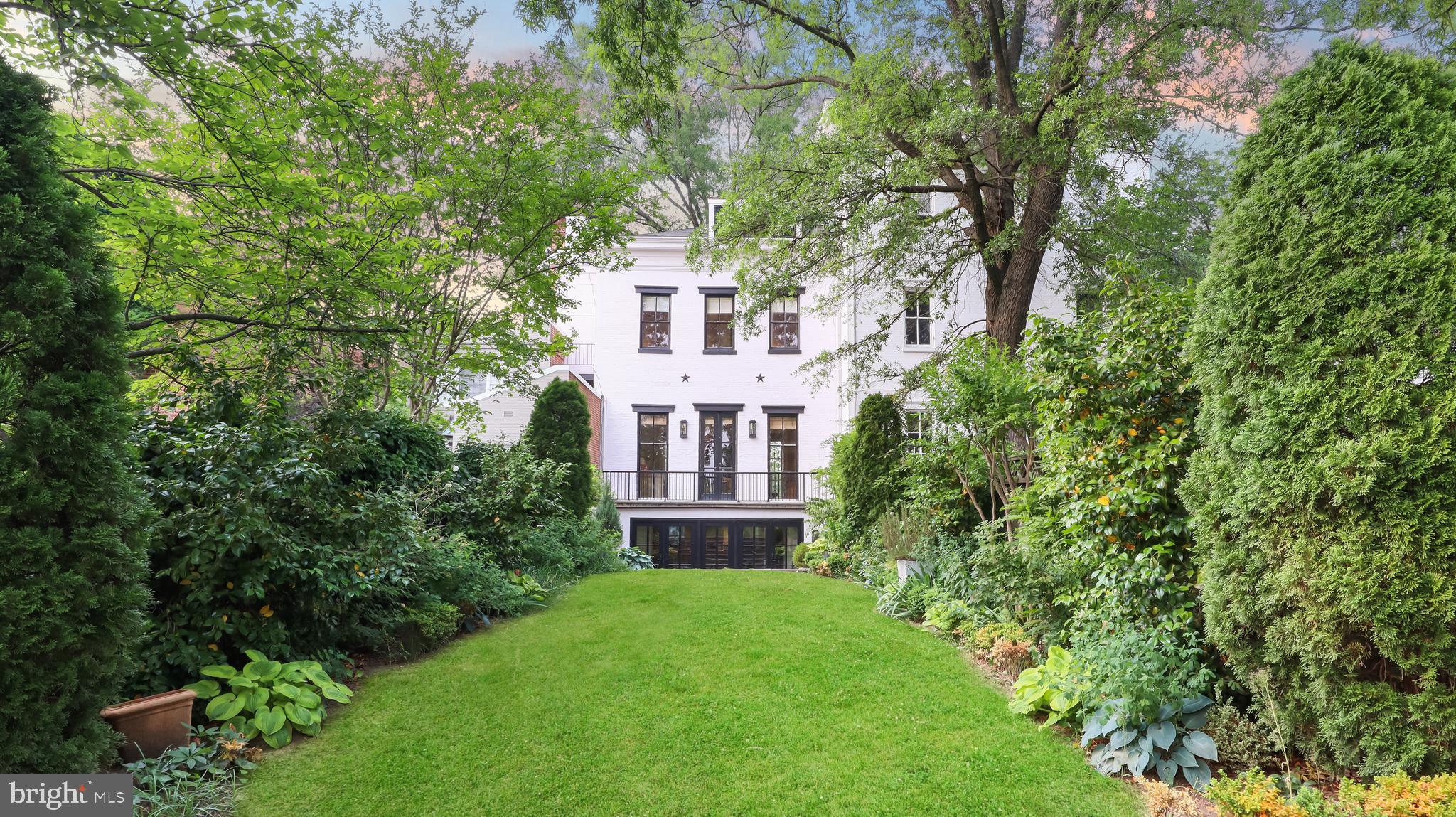 Beautifully renovated home by architect Christian Zapatka in the west village of Georgetown.  Views of the Washington Monument, Lincoln Memorial, Watergate, Kennedy Center, and the Potomac River. Nearly 13-foot ceilings greet you upon entry. Four levels of luxurious living space, with a total of three bedrooms, three and a half bathrooms and an exterior surface parking space towards the rear of the home.

Oak herringbone hardwoods throughout. Main level features a spacious living room with a cozy fireplace, and access to balcony with serene views of the private garden. Eight-foot-high restored “Jefferson” windows flank the living space allowing natural light from the northern and southern exposure to fill the room.

Gourmet kitchen is a chef's dream and features top-of-the-line stainless steel appliances, butcher block countertops, and ample built-in and cabinet space. The adjacent breakfast nook is the perfect spot for enjoying your morning coffee or a casual meal. The dining room area with plenty of space for a large table and chairs. The exposed beams add grandeur to the overall design.  Step out into the rear patio and expansive yard  – an extension of the interior living space.

On the Upper 1 level find the bright and airy primary suite, complete with a large walk-in closet and a spa-like ensuite bathroom with double sinks, high-end fixtures, and steam shower.  Enjoy sunset views from the primary bedroom balcony.  Additional cozy bedroom or TV/sitting room with ensuite bathroom.  Third bedroom on the Upper 2 level with “jewel box” windows frame views of the city & monuments, private full bathroom adjacent. 

Located less than a block from Georgetown's world-class shopping, dining, and entertainment options, this home offers the ultimate in luxury and convenience.