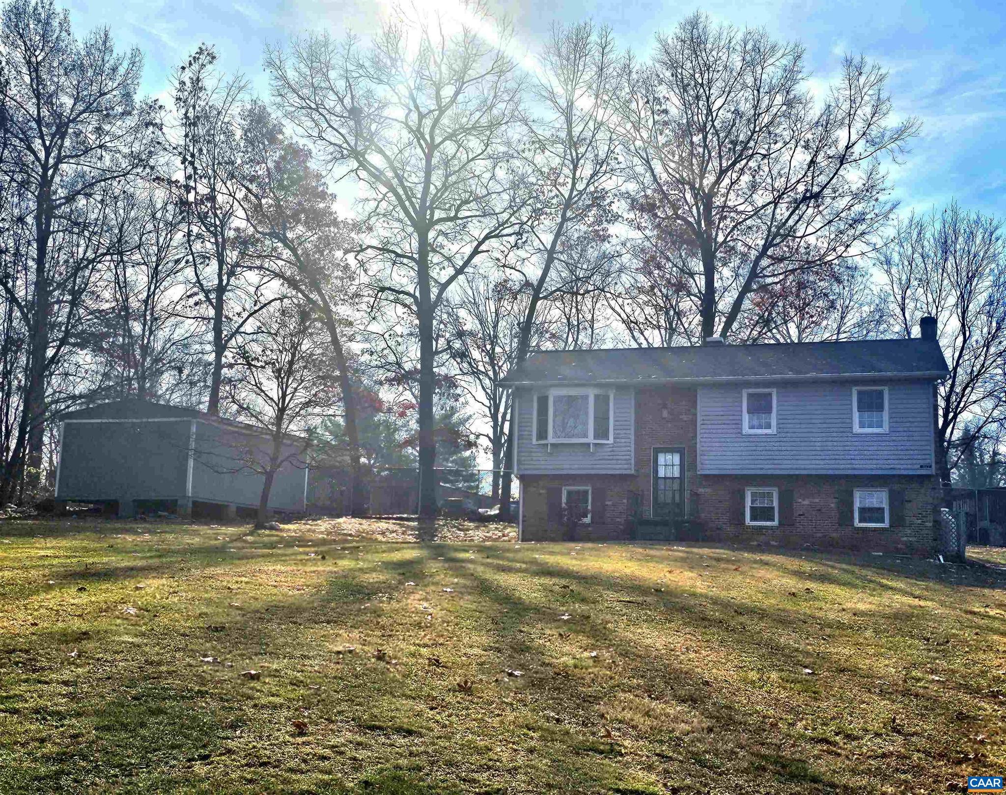 Location! Location!  This spacious home sits at the end of a cul-de-sac with over an acre of yard just a half mile off of Route 29.  This home offers hardwood floors, gas fireplace for those cold nights, 3 bedrooms upstairs, additional rooms on the lower level for a home office, guest bedroom, whatever you need them for, 2 outbuildings,  the yard is fenced except for the front, and more! The roof is less than 10 years old, hot water heater was just replaced, all lower level plumbing was just updated.  This home is waiting for you and your personal touch!,Wood Cabinets,Fireplace in Basement,Fireplace in Family Room