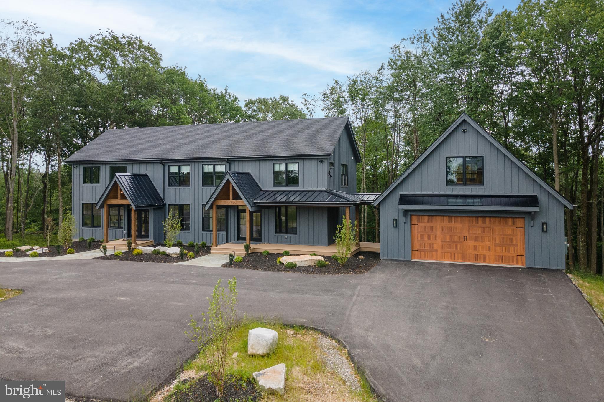 “Endless Journey” delivers mountain living with a bold punch. A proven rental clearing over $100k in 2024—this six-bedroom, six-full, two-half-bath retreat sits in a quiet wooded pocket with wide southwest views rolling across the trees. A huge open living area runs bright and modern, with clean lines, warm finishes, and a sharp stone fireplace. Shiny kitchen with stone tops, custom cabinetry, stainless appliances, and an island bar. En-suite baths offer tiled showers and heated floors. Spacious layout opening to multiple outdoor spaces made for slow mornings and long nights. The deck pulls in the sunset, while the hot tub and fire pit round out the mountain vibes. Loads of additional living space! Lower level complete with a game room and wet bar. Two-car garage with a bonus hangout upstairs. Ski nook that keeps boots, boards, and gear organized. Durable luxury vinyl flooring, Trex-style decking, public water and sewer, and a whole-house generator keep the home low-maintenance and ready for every season. The setting puts you minutes from skiing, snowboarding, local marinas, and every local spot along 219. A strong rental, private escape, and a turnkey launchpad into the Deep Creek lifestyle. Call today to schedule your private showing!