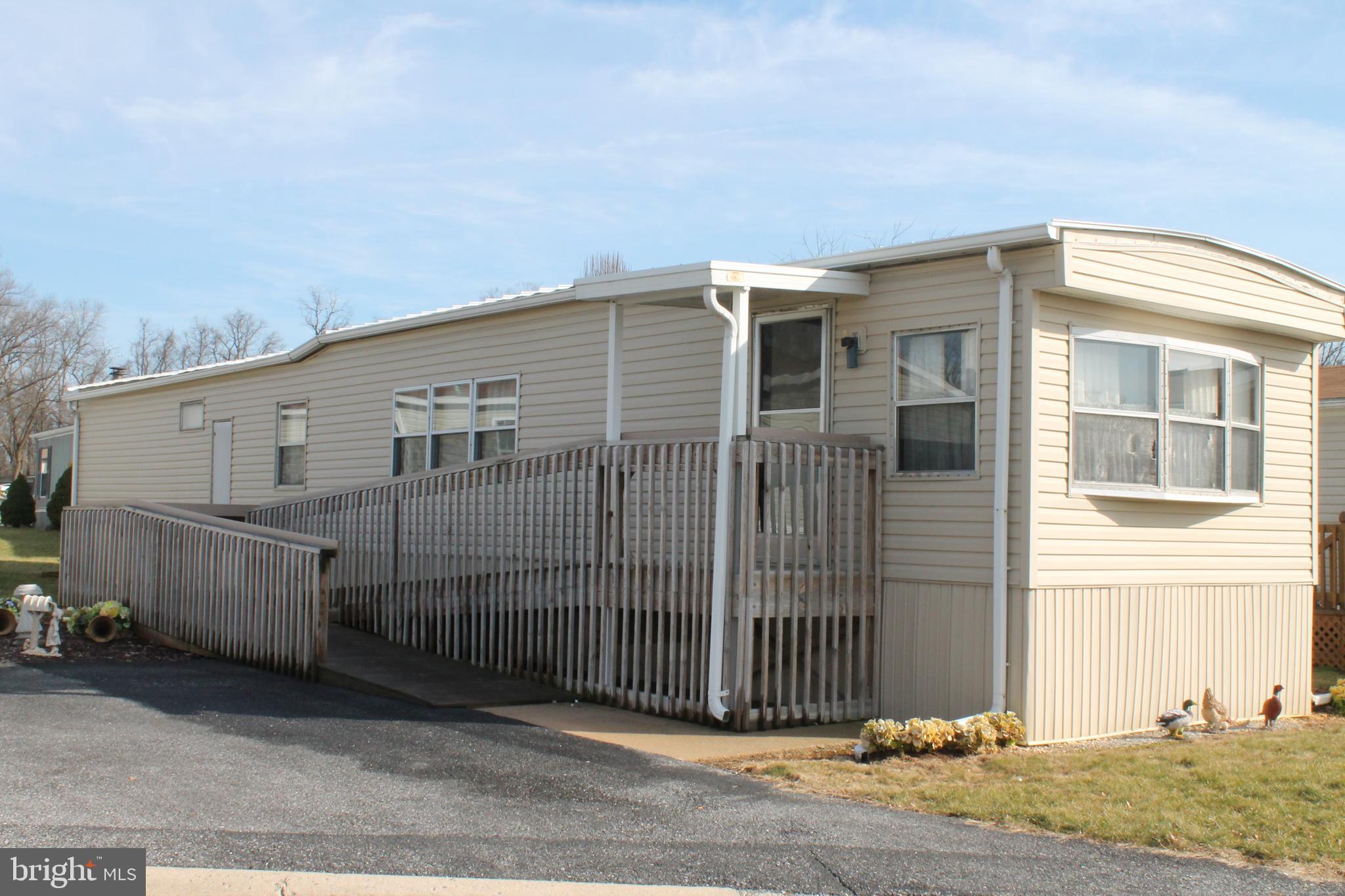 1972 New Moon with vinyl siding and steel roof x  Handicapped ramp, 2 car driveway x kitchen with breakfast bar, dining room, bright open living room.  2 bedrooms and bath x Newer furnace, AC, and water heater, electric panel updated in 2012 and new hat tape in 2014 x Seller has  maintains yearly contract with Electric and HVAC x contact agent for park information.   THE LOT RENT IN THE PARK IS $337 PER MONTH includes trash and sewer.