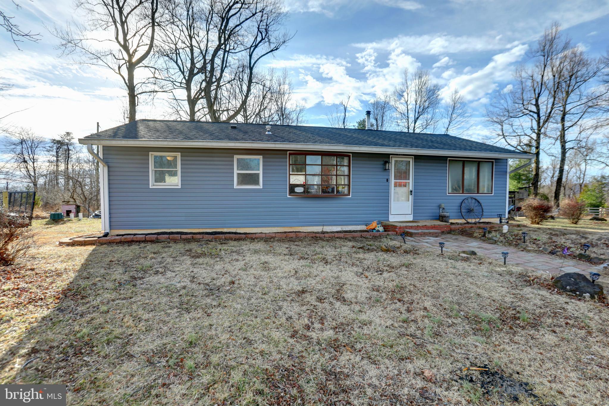 A spacious 3-bedroom, 1 full and 1 half bath ranch set on a rare triple lot in the established community of Linden, offering true one-level living on level, usable acreage with the privacy, mountain backdrop, and micro-farmette potential buyers are always searching for — and rarely find.

From the moment you arrive, the setting stands out. Three combined lots create an expansive, level homesite framed by seasonal mountain views, mature trees, fruit trees, and enclosed garden planting areas that give the property a true micro-farmette feel. A chicken coop (2024) and a small animal enclosure are already in place, thoughtfully connected to the enclosed garden areas, with a 500-gallon fresh water tank servicing the enclosure to support a more self-sufficient lifestyle. A new enclosed garden (2025), new playground (2025), new wood shed (2025), and log splitter (2025) further enhance the functionality of the land. The rear deck — newly built in 2026 — overlooks it all, offering the perfect place for morning coffee, evening gatherings, or simply taking in the quiet that defines this stretch of Linden. A new roof (2022) and new siding (2025) add peace of mind, while a recent septic inspection and pumping (2025) provide additional confidence in the property’s infrastructure.

Inside, the main level reflects extensive recent improvements, blending comfort with fresh, modern finishes. The kitchen has been completely refreshed with new kitchen cabinets (2026) and brand-new appliances (2026), offering both style and functionality. New LVP flooring, baseboards, and crown molding (2026) run throughout the main living areas, creating a cohesive, updated feel, while new carpet in the bedrooms (2025) adds warmth underfoot. The living room remains anchored by a warm wood-burning stove, creating a natural focal point and inviting atmosphere during cooler months, and the dining area provides defined space for everyday meals or hosting. A new water heater (2026) adds further value and efficiency.

All three bedrooms are oversized and well-proportioned, including a spacious primary bedroom. The full bath features custom tile work, and the additional half bath adds everyday convenience. With everything thoughtfully arranged on one level and so many recent upgrades already completed, daily living feels simple, functional, and move-in ready.

Beyond the property itself, the location offers something truly special — sweeping views of all of Front Royal just a short walk to the nearby community viewing area down the street. Whether it’s sunrise over the valley or evening lights below, the panoramic scenery becomes part of your everyday routine.

For added convenience, the log splitter, existing wood piles, and playground equipment all convey, making this property as practical as it is enjoyable from day one.

Located less than 10 minutes to I-66 and approximately 30 minutes to Manassas, this home offers an easy commuter route while maintaining the peaceful, retreat-like setting that draws buyers to Linden. Enjoy close proximity to Skyline Drive, the Shenandoah River, Appalachian Trail access points, local wineries, and the shops and restaurants of Front Royal. Zoned for Warren County Public Schools, including Hilda J. Barbour Elementary, Warren County Middle, and Warren County High School.

Level triple-lot acreage, one-level living, significant recent upgrades, mountain views, and micro-farmette versatility — a combination that is increasingly rare in this market.