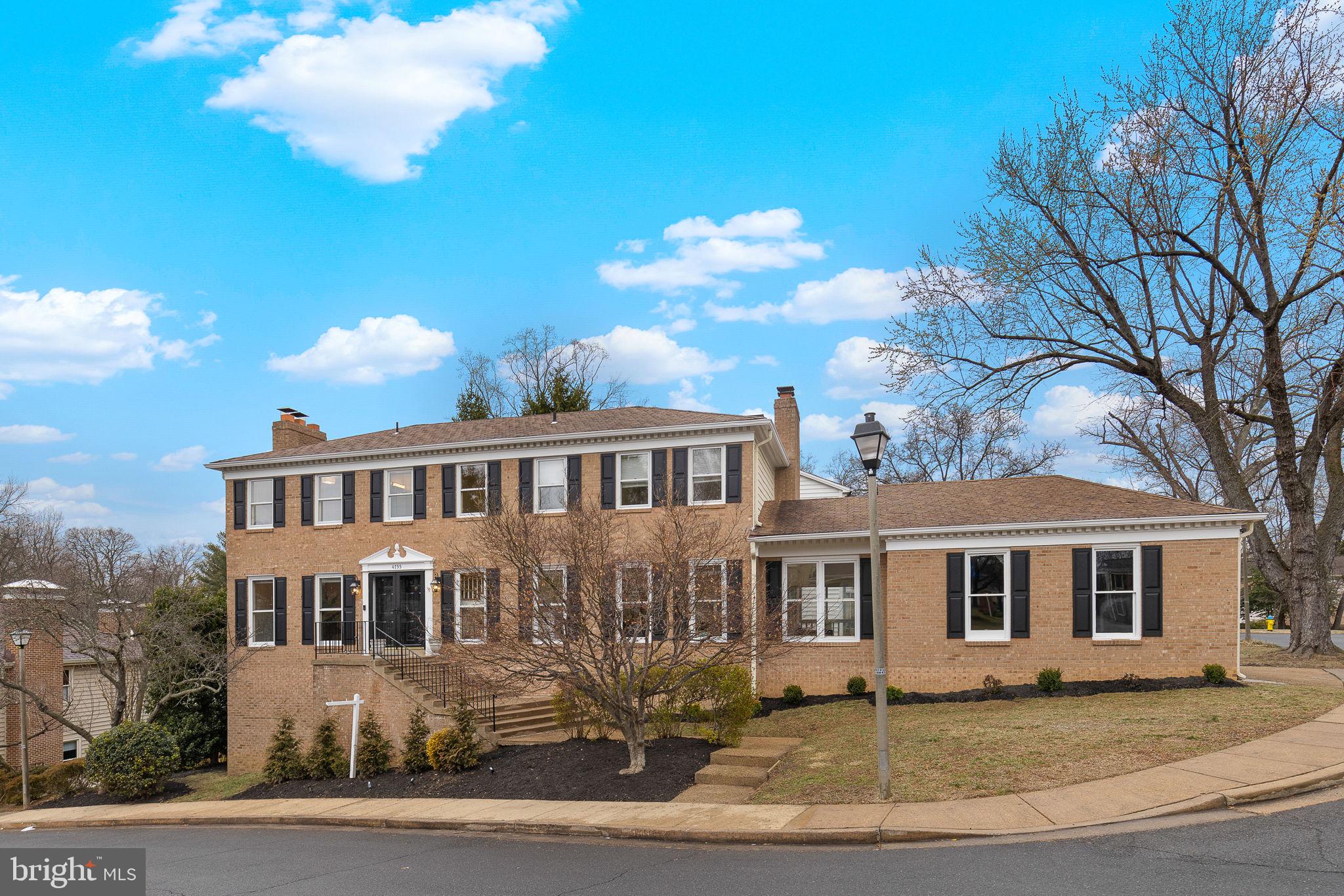 N. Arlington Stunner! All-brick Colonial seamlessly blends classic charm with modern elegance. Newly finished hardwood floors grace the main and upper levels, enhancing the home's timeless appeal. Upon entry, you're welcomed into a gracious living and dining area, complete with a wood-burning fireplace and French doors that open onto a deck stretching across the rear of the home perfect for entertaining.
The grand kitchen boasts stainless steel appliances, quartz countertops, a spacious island, abundant cabinetry, and oversized windows that flood the space with natural light. It flows effortlessly into the inviting family room, where another wood-burning fireplace adds warmth and character. Just off the family room, a versatile mudroom/office with skylights provides the perfect organizational hub, with direct access to deck and 2-car side-load garage. A laundry room and half bath complete the main level. Upstairs, you'll find four generously sized bedrooms and three full bathrooms, including a luxurious primary suite with an updated spa-like bath with dual sinks and soaking tub, a serene sitting room, and the home’s third fireplace. A second bedroom also offers the convenience of another updated en suite bathroom. The fully finished lower level provides incredible flexibility, featuring a complete in-law or au pair suite with multiple finished rooms and a fireplace ideal for a recreation area, game room, or additional bedroom plus ample storage. French doors lead to a private patio, extending the home’s indoor-outdoor living. The backyard includes a patio, perfect for relaxing evenings, or a safe play space for pets, it offers just the right amount of outdoor space without a lot of upkeep. Enjoy access to two spacious, beautifully maintained common areas—perfect for gatherings, play, or relaxing outdoors. Both are maintained and covered by the HOA.  Located in the  Yorktown School Pyramid and only a block to Jamestown elementary school. This exceptional home is just minutes from McLean, DC, Tysons, and all that Arlington has to offer. A rare find in both design and location!