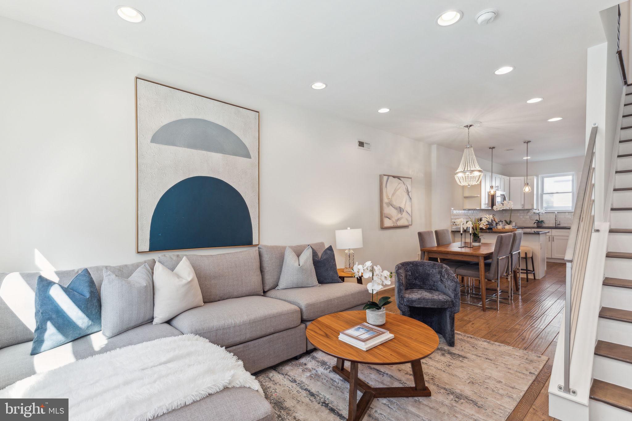 Nestled in the heart of Pennsport, this beautifully updated, move-in-ready home perfectly combines modern comfort with the charm of its vibrant neighborhood. From the moment you step inside, you’ll be greeted by a bright, freshly painted interior and an open-concept layout, designed for both everyday living and effortless entertaining. With a double tier rooftop deck, a finished basement and storage galore and more this home is a one of a kind, hard to find gem! The first floor welcomes you with a spacious living room, featuring hand-scraped hardwood floors that flow seamlessly into a dining area. At the rear of the home, a stylish L-shaped kitchen awaits, outfitted with sleek white shaker cabinets, granite countertops, stainless steel appliances, a subway tile backsplash, and a convenient pantry. The breakfast bar, adorned with chic pendant lighting, offers the perfect spot for your morning coffee or casual meals. Step outside into your private backyard, a rare find in the city, offering space for grilling, gardening, or simply relaxing in your own outdoor oasis. The finished basement adds even more flexibility to this home, providing space for a home office, media room, or playroom for the kids. Plus, the separate laundry room and additional storage ensure you have all the space you need for daily life.Modern steel railings lead you upstairs to two spacious bedrooms, each with generous closet space, and a shared full bathroom boasting sleek, contemporary finishes. On the top floor, you'll find your private primary suite—a true retreat. The spa-inspired bathroom features a seamless glass shower with a rain shower head, along with a custom walk-in closet. Thoughtfully designed, the suite even includes second-floor laundry hookups for added convenience.Take your relaxation or entertaining to the next level on the private roof deck, offering breathtaking panoramic views of the city skyline and bridges, plus front-row seats to the city’s famous fireworks shows.Location couldn’t be more ideal—just blocks from Target, Giant, Lowe’s, and the big-box stores along Columbus Boulevard, this home places you steps away from some of South Philly’s most beloved local spots. Savor neighborhood favorites like Federal Donuts, Mifflin Tavern, and the creative, Mexican-inspired pizzas at Tonalli. Don’t forget to visit O’Jung’s  for an Arctic Splash -a unique treat! Dickinson Square Park, with its weekly farmers market and popular playground, is just a few blocks away, while Herron spray ground offers a perfect summer cool-off spot. With easy access to I-95, 676, and SEPTA transit options, this home delivers the perfect blend of urban convenience and neighborhood charm. This home is conveniently located just a 6-minute walk from the free parking lot on Tasker street under 195, making parking a breeze. Plus, it comes with a tax abatement for a few more years, making it even more desirable. With its seamless blend of thoughtful amenities, spacious design, and unbeatable location, this home is the best home on the market in Philly!