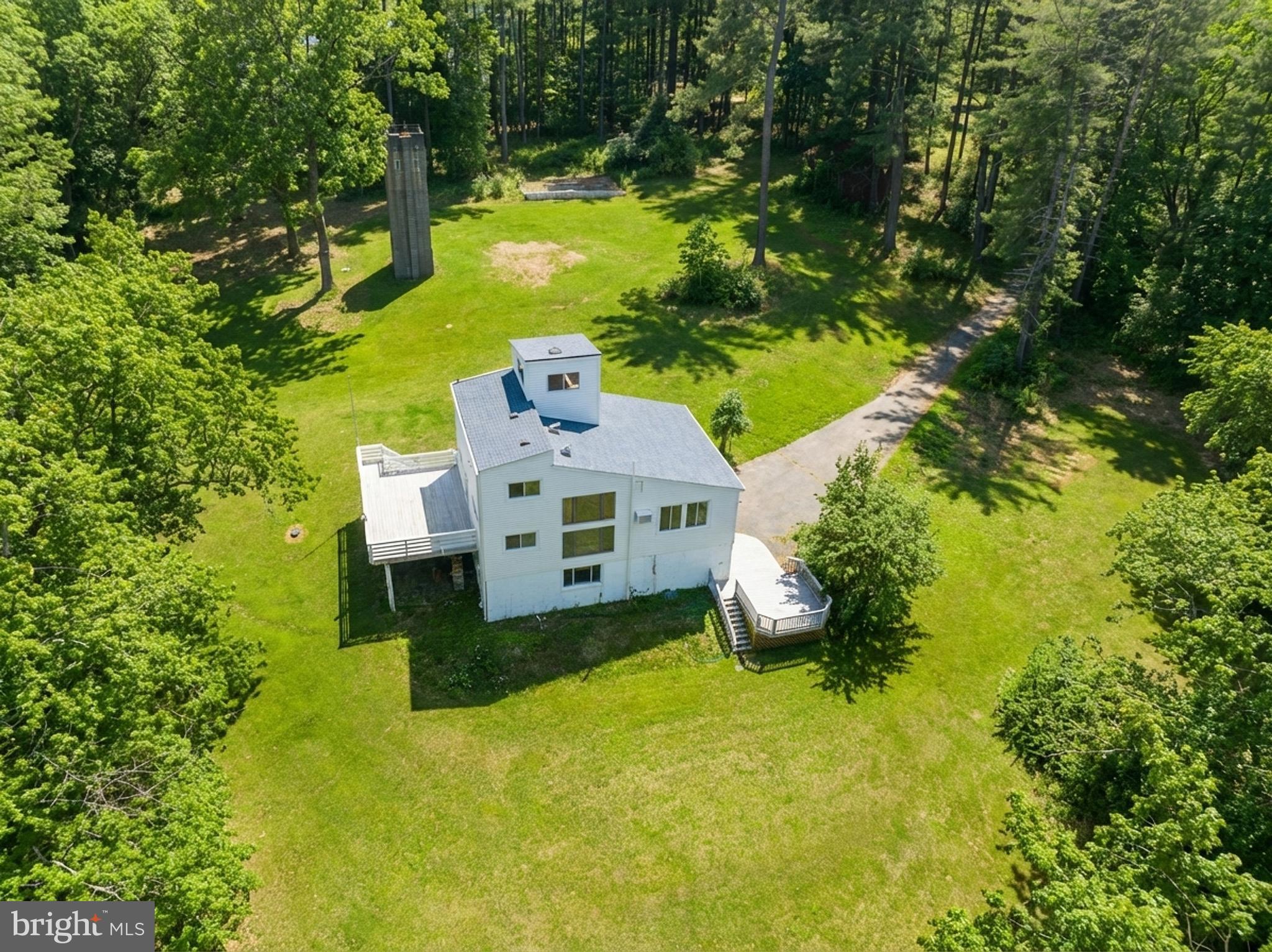 This rare, five-level estate sits on 6.87 wooded acres, offering ultra-privacy and a 4-story detached Castle Keep. It’s definitely not your standard backyard shed—it's essentially a private, four-story minicastle! 

This amazing home features three bedrooms plus a bonus/hobby room across 5 levels of unique living space.  The Master Suite offers a sunken design, vaulted ceilings, and a spa bath with a gas fireplace.  The kitchen has new stainless-steel appliances.  There's a separate utility-ready pad site for an RV or guest house, offering unlimited potential.  Enjoy peace of mind with a new roof (2025), updated electrical (2022), and a waterproofed basement. This private lot is near the Potomac River; no HOA.

The home is as sturdy as it is stylish, featuring energy-efficient thick masonry walls and several recent high-ticket upgrades:

New Roof (2025), Electrical Panel (2022), Septic Distribution Box (2021), Radon System (2021).  There is also a new well water accumulation tank, filtration system, and hot water heater.
