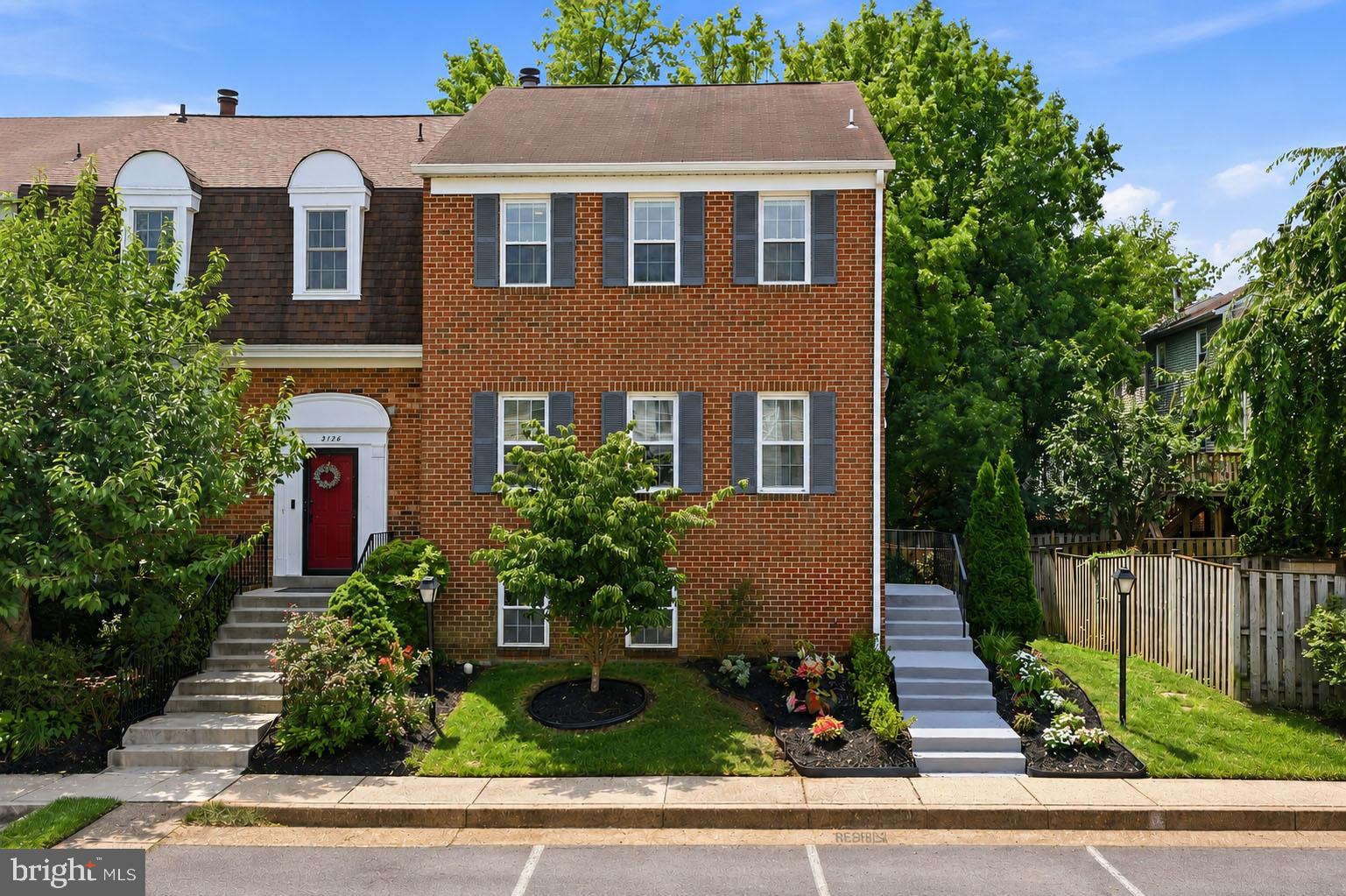 Welcome to this exceptional all-brick end-unit townhome in the highly sought-after Oakton Village community! Offering 4 bedrooms, 3 full baths, and 1 half bath, this beautifully updated home combines timeless elegance with today's open-concept living.

The sellers thoughtfully renovated the main level by removing the kitchen wall to create an open, light-filled floor plan perfect for entertaining and everyday living. The gourmet kitchen features abundant custom cabinetry, granite countertops, a spacious center island, a custom refrigerator, newer appliances, and a charming bay window that fills the space with natural light. The adjoining dining and living areas showcase beautiful hardwood flooring and oversized windows, creating a warm and inviting atmosphere.

Upstairs, the spacious primary suite features a beautifully renovated spa-inspired bath, while the additional full bath has also been tastefully updated. High-quality hardwood flooring extends throughout the upper level, complementing the home's elegant finishes.

The fully finished walkout lower level offers exceptional flexibility with a fourth bedroom, a renovated full bath, and a spacious recreation room with direct access to one of the largest fenced backyards in the community. The custom concrete patio was designed for entertaining, outdoor recreation, and even accommodates a basketball hoop. A large storage shed provides valuable additional storage.

Recent improvements include renovated primary, hall, and lower-level bathrooms, an updated powder room and foyer, newer windows, a newer patio door, newer kitchen appliances, a newer Hybrid large capacity water heater, professionally refinished patio, fresh interior paint, updated lighting, professionally cleaned air ducts, and a recently serviced HVAC system for added peace of mind.

Residents of Oakton Village enjoy outstanding amenities, including a community pool, tennis courts, tot lots, walking trails, and beautifully maintained common areas. Ideally located just minutes from the Vienna/Fairfax-GMU Metro, I-66, Route 123, shopping, dining, parks, and top-rated Fairfax County schools, this move-in-ready home offers an exceptional combination of space, quality, location, and lifestyle.

A rare opportunity to own one of the community's premier end-unit townhomes with one of its largest private yards.