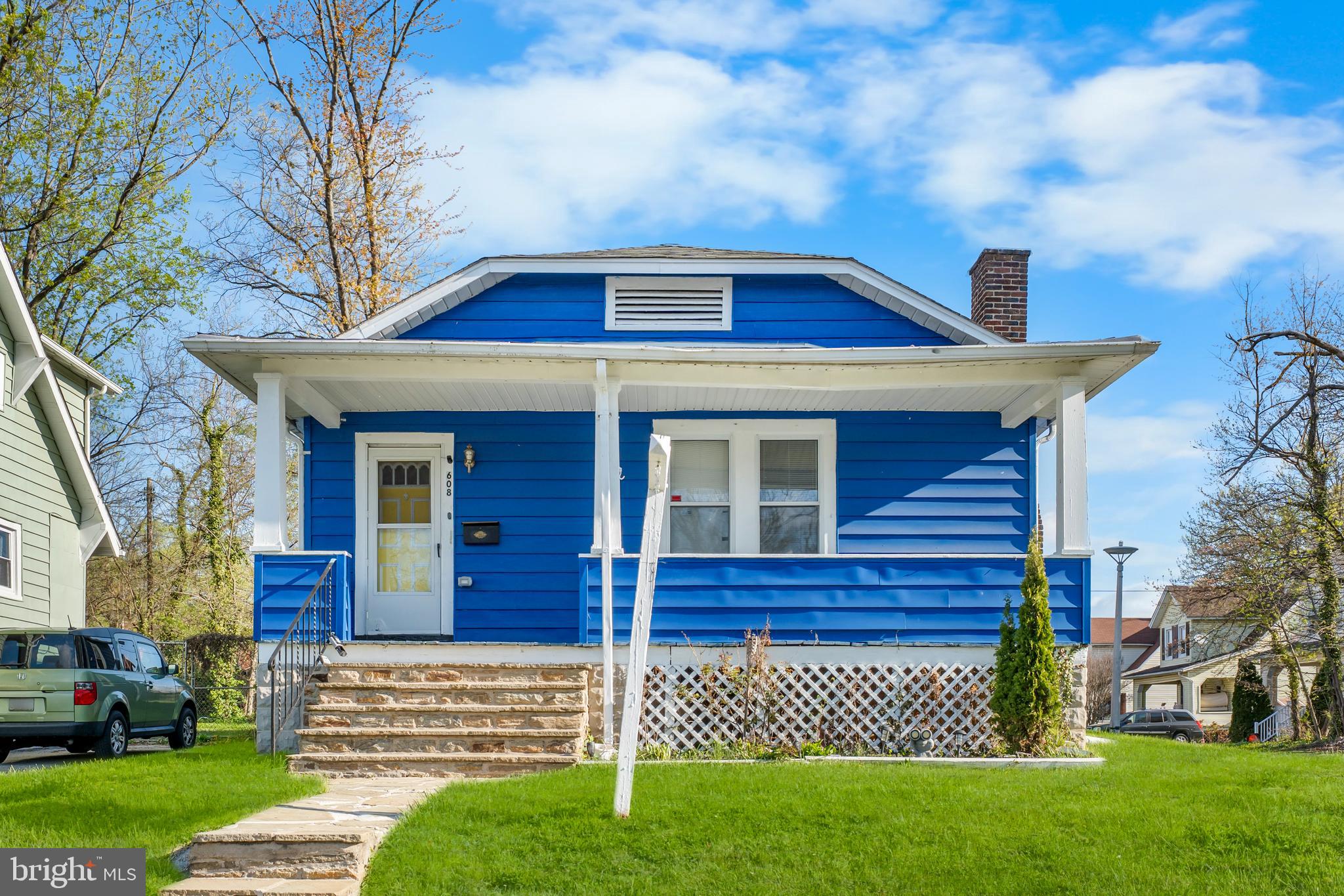 Charming rambler-style home with a Craftsman-inspired façade, perfectly situated on a large corner lot and highlighted by an inviting oversized front porch—ideal for relaxing or entertaining. This well-maintained residence features 3 spacious bedrooms and 2 full baths, including a generous primary suite with a private bath complete with separate jetted soaking tub and stand-alone shower.

Hardwood floors flow throughout the home, enhancing its warmth and character. The living room welcomes you at the front entrance and showcases a beautiful fireplace with mantel, creating a cozy focal point. Just off the living room and kitchen is a spacious dining area that comfortably accommodates a 10-seat table, perfect for gatherings and everyday living.

The fully functional kitchen offers a pantry, modern appliances, and a convenient center island, providing both style and practicality. A versatile bonus room located off the rear entrance serves perfectly as a mudroom, den, or flexible living space.

The unfinished basement offers excellent ceiling height and the potential to finish approximately half for additional living space. The waterproofed lower level currently houses the heating system/furnace, hot water heater, and washer and dryer, ensuring peace of mind and functionality.

Situated on an oversized lot, this property provides ample room for off-street parking, outdoor living, or future development opportunities. A true open canvas with charm, space, and potential—ready for its next owner to make it their own.