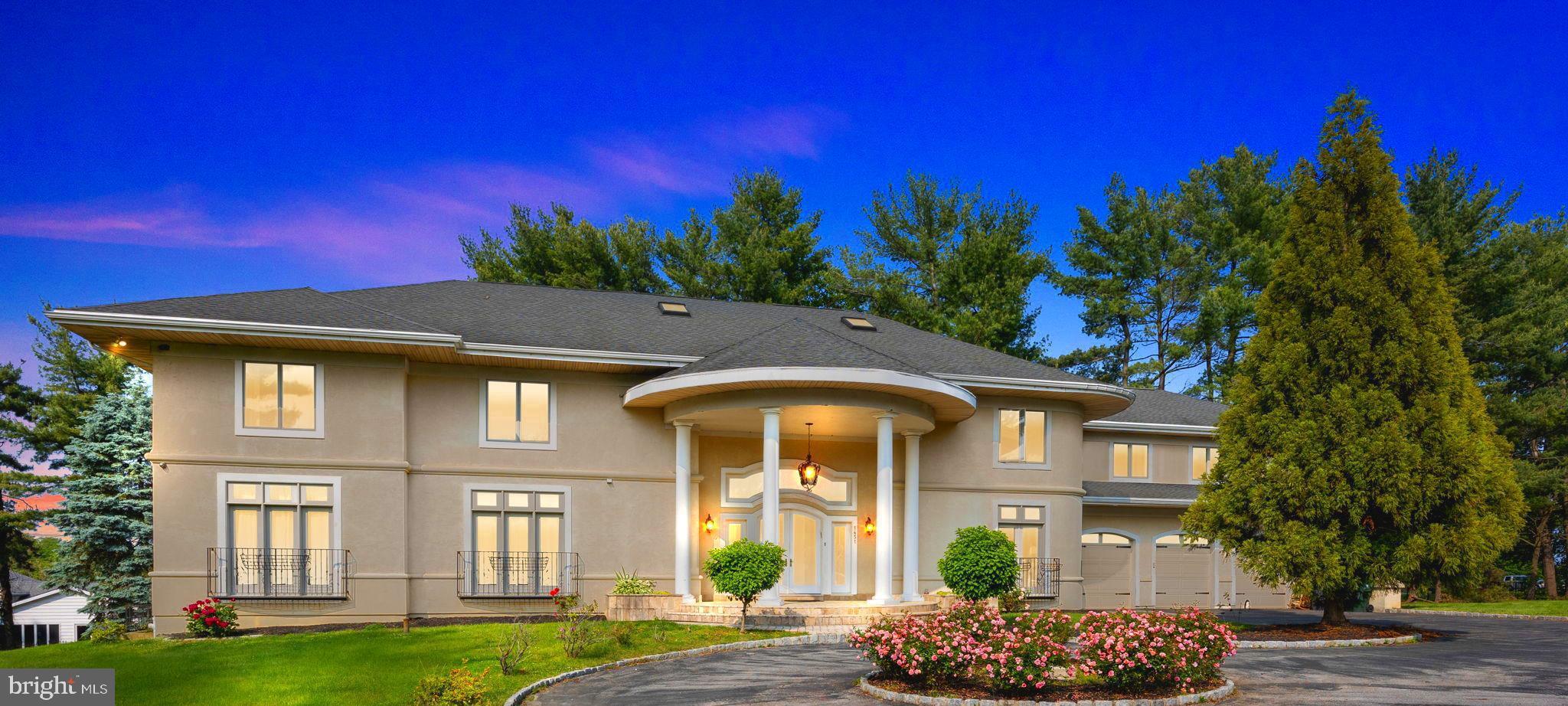 Welcome to 1451 Lorimer Avenue ! 
Your grand, dream home awaits in the prestigious Huntington Valley, Montgomery County in the exceptional Abington school district with an effortless commute to all major highways. 
This luxurious custom - built residence spans 7,700 square feet with seven bedrooms, a bedroom or office on the main level and five and a half bathrooms showcasing exquisite craftsmanship and high-end finishes with a three car garage and a circular driveway. 
Upon entering, you are greeted by imported custom crown molding and a stunning two-story cathedral foyer featuring elegant columns and custom glass front doors. 
Crystal chandeliers illuminate the grand, straight - through foyer with double spiral staircases and vaulted ceilings, creating an opulent ambiance. 
The main level boasts Versace tile floors and a bedroom with a decorative Juliet style balcony, 
a gourmet kitchen, dining room and formal living room. The kitchen equipped with granite countertops, custom cabinets, Sub-Zero refrigerator, Viking range, and Bosch dishwasher.
Upstairs, the primary suite is a sanctuary with a large shower, Jacuzzi tub, and an expansive walk-in closet. The additional bedrooms feature unique amenities such as skylights, walk-in closets, and access to multiple decks.
The fully finished 2,600 square foot walk-out basement offers versatile living space with a in law / au pair suite with imported hardwood floors and a full bathroom. This flex space may be used as a media or family room if an inlaw / au pair suite isn't needed.. 
The bright and airy walk out basement includes a pre-fitted area for a sauna and French doors leading to the yard.
Outdoor living is highlighted by a 400 square foot deck, a 200 square foot deck, and a 1,200 square foot second-level deck accessible from multiple bedrooms. The fenced backyard ensures privacy and security, complemented by a top-of-the-line security system.
Modern conveniences such as gas heating, commercial-grade glass, and a new washer/dryer in the basement laundry area ensure comfort and efficiency and a new HVAC system.
Combining modern amenities with timeless elegance, this exceptional property offers a lifestyle of luxury and comfort in Huntington Valley.
The process is the same as a standard sale.