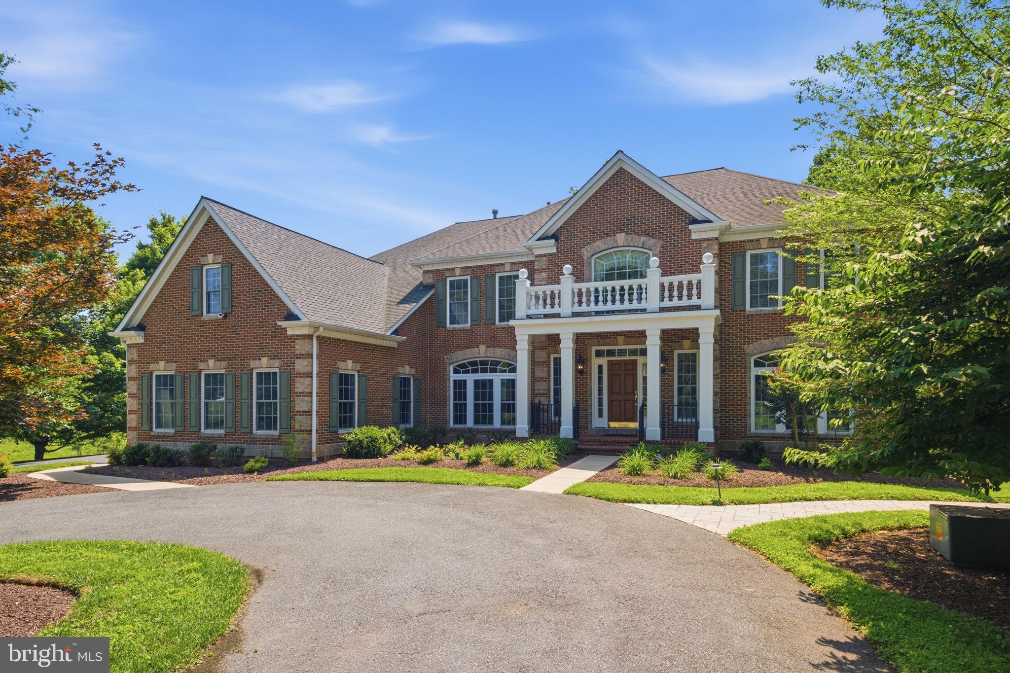 UNMATCHED VALUE & SCALE ON THE POTOMAC BORDER. Sprawling across approximately 8,939 total finished square feet of combined luxury living space on a premium, ultra-private 2.5-acre lot, this custom-built estate offers an extraordinary scale of land and structure for under $1.9M. Priced at a highly competitive $212 per total finished square foot—far below current custom luxury reproduction costs—this property delivers immediate, exceptional value and a strategic opportunity for a buyer to customize cosmetic styling to their exact taste.

An exceptional home for grand entertaining, the residence is defined by impressive proportions, timeless architectural presence, and premium custom features. A commanding circular driveway leads to a three-car garage and a magnificent brick front facade opening to a two-story foyer anchored by a dramatic curved dual staircase. The main level transitions seamlessly between formal living and dining spaces, a library/office, and a spectacular sun-drenched conservatory wing. The gourmet kitchen features custom cherry cabinetry, a substantial center island, and high-end professional stainless appliances, flowing into an expansive morning room. A soaring two-story great room boasts custom coffered ceilings, custom built-ins, and a pristine gas fireplace.

Upstairs, the luxury primary retreat features a dedicated sitting area, an oversized walk-in closet, and an en-suite bath with a shower and soaking tub. Three additional upper-level bedrooms function as private junior suites, each offering dedicated en-suite full baths and large walk-in closets.

The fully finished walk-out lower level offers independent multi-generational utility or grand entertaining, complete with a secondary recreation area, a second fireplace, wine storage, and a private guest suite with a full bath. Outside, the rear estate opens to a private resort paradise: an in-ground pool, expansive hardscaped two-tier stone patios, and an elevated composite deck backing to mature tree lines.

Minutes from the C&O Canal, River Road, and major commuter arteries into DC.