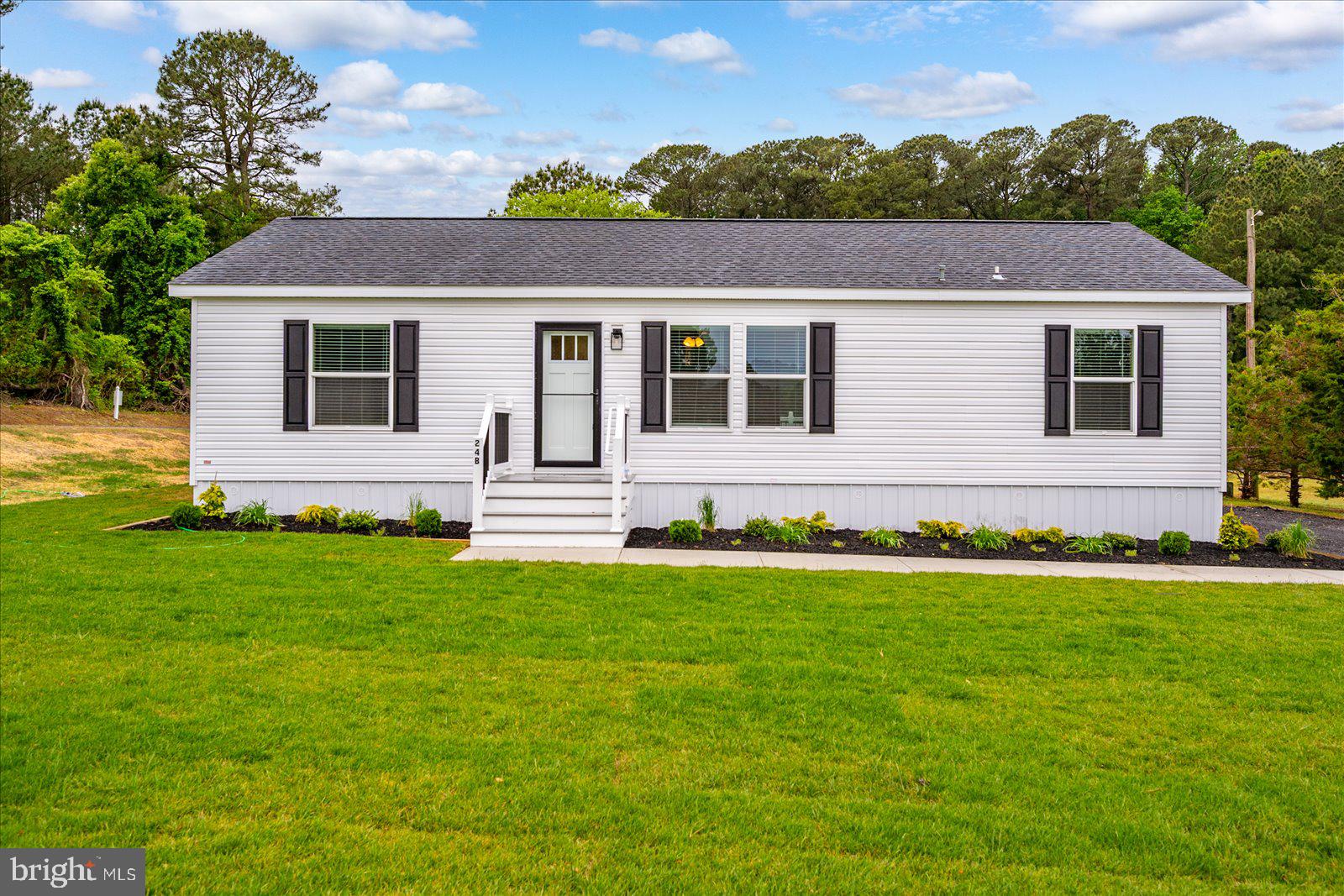 One of the most affordable opportunities for new construction living in the area! Ideally situated in a quiet community just outside the Town of Berlin, this upgraded 3-bedroom, 2-bath modular home offers the perfect balance of peaceful living and convenience. Located just moments from Sunset Lakes Park and only a short drive to Assateague Island and Ocean City beaches, you’ll enjoy easy access to some of the Eastern Shore’s best attractions while coming home to a serene setting. Set on a premium high corner lot, this home is loaded with upgrades and truly must-see. Features include Trex decking, a fully sodded yard, and a privacy-fenced backyard surrounding the mini barn creating a private outdoor retreat perfect for relaxing or entertaining. Everything is brand new and thoughtfully designed for low-maintenance living. Park fees include trash pickup, and with no property taxes, this home offers exceptional value and affordability. Move-in ready and packed with features, this is an incredible opportunity to enjoy like-new living near Berlin, Assateague, and Ocean City.