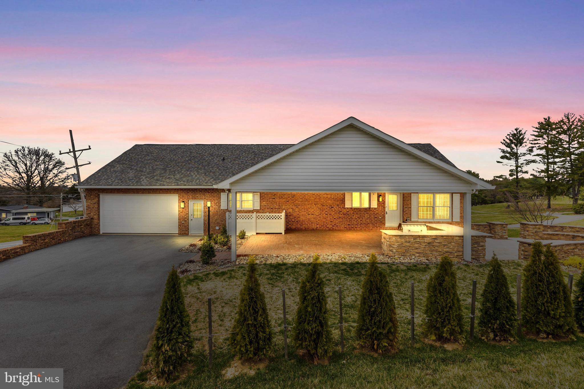 This magnificent brick colonial is not just a home; it's a lifestyle choice that combines luxury and comfort. The two-story front porch serves as a perfect vantage point to soak in the serene views of the Beaver Creek Country Club golf course, making it an ideal spot for morning coffee or evening relaxation. Inside, the open layout is designed for both functionality and style. The three-sided fireplace creates a cozy atmosphere, whether you're cooking in the kitchen, enjoying a meal in the dining area, or relaxing in the living room. The kitchen itself is a chef's dream, featuring elegant granite countertops and high-end stainless steel appliances, including a double oven, making it perfect for hosting gatherings or preparing meals. The home boasts five spacious bedrooms, ensuring ample space for  guests. Four of these bedrooms come with their own en-suite bathrooms, offering privacy and convenience. The fully finished upper level adds versatility, making it suitable for use as an additional guest suite, home office, or playroom, complete with its own bathroom. For outdoor entertaining, the covered back porch with a fabulous paver and brick patio and outdoor kitchen is a standout feature. It provides a perfect setting for barbecues and gatherings, while the adjacent patio offers additional space for relaxation or entertaining. This home is designed for those who appreciate both indoor and outdoor living, making it a perfect retreat for families and entertainers alike.