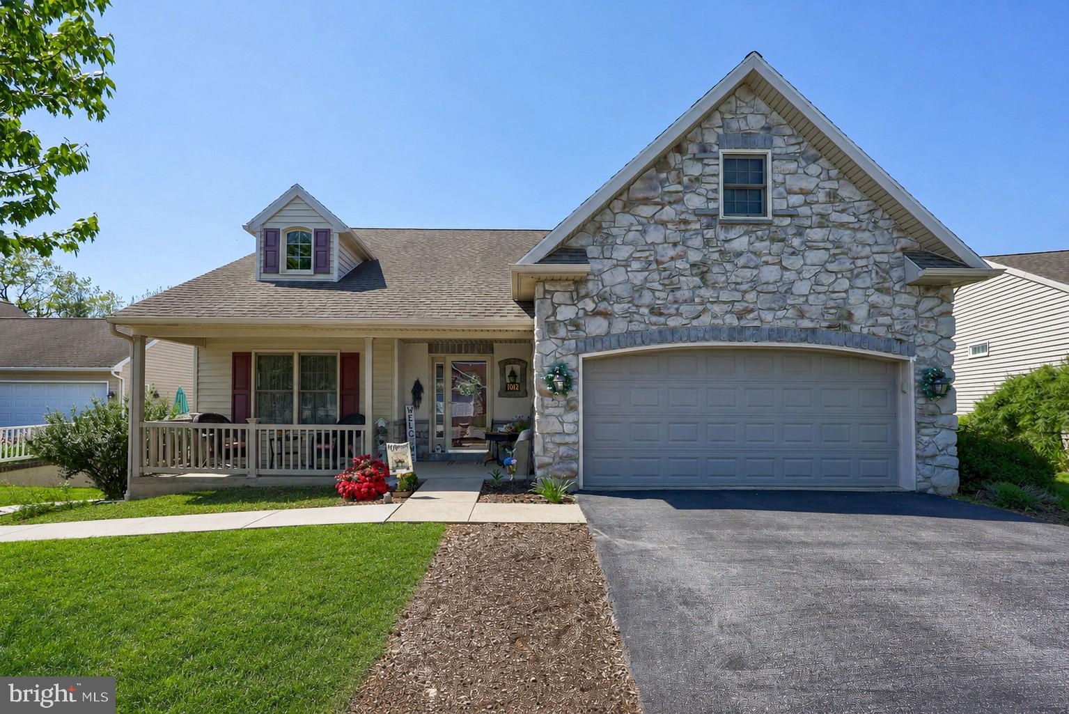 Welcome to 1042 Cambridge Drive in Manheim. This beautifully maintained home offers 4 bedrooms, 2.5 baths, and over 2,500 finished square feet with a thoughtful layout designed for comfort, convenience, and everyday living.

The main level features a welcoming foyer, hardwood flooring, a bright family room with a gas fireplace, a spacious kitchen with island seating, stainless steel appliances, and an easy flow into the dining area and sun room. The first-floor primary suite includes a generous bedroom,  large walk-in closet, and private bath with a jetted tub, separate shower, and double vanity. A second main-level bedroom (currently used as an office), powder room, and laundry area add flexibility and function.

Upstairs, you’ll find two additional bedrooms, a full bath, walk-in closet space, and attic storage. The large basement provides excellent storage and future possibilities, while the rear deck offers a comfortable outdoor space to relax or entertain. Additional highlights include an attached garage, welcoming front porch, and a planned community setting in Penn Township offering a club house, walking trail, neighborhood pond, and fitness area. 

Conveniently located near Manheim, Lititz, Lancaster, shopping, dining, and major routes, this home offers a great combination of space, comfort, and low-maintenance living.