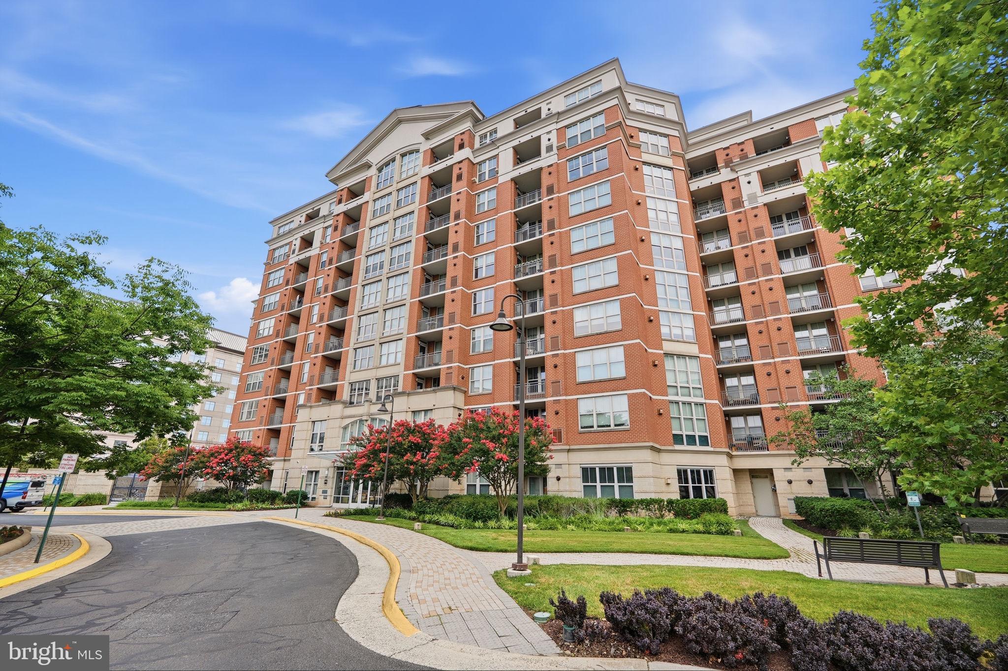 Experience elevated living at The Mercer in Reston! This stunning 2-bedroom, 2-bath corner residence is ideally situated on the 8th floor, offering breathtaking panoramic views stretching all the way to Tysons Corner and spectacular sunrises visible from every room. Abundant natural light fills the home, creating a bright and sophisticated atmosphere throughout.
The main living area features beautiful solid French oak hardwood flooring, while distinctive Olive Barcelona cork flooring extends throughout the remainder of the condo, adding warmth, style, and character. Thoughtfully designed for both comfort and convenience, the home also features stainless steel appliances and custom closets. The windows are covered with remote motorized 3/4" light filtering honeycomb cellular shades.  The HVAC system, water heater, and full-sized washer and dryer were all replaced in 2019.
The Mercer offers an exceptional lifestyle with concierge service, on-site management, an outdoor swimming pool, fitness center, billiards/club room, and business/conference center. Residents also enjoy access to Reston’s extensive array of recreational amenities through the HOA.
Ideally located just minutes from major commuter routes, bus service, Metro, shopping, dining, and all that Reston has to offer, with Dulles International Airport approximately 10 minutes away. From its luxurious finishes and panoramic views to its exceptional location and outstanding amenities, this beautiful corner residence offers the perfect combination of contemporary elegance, comfort, and convenience.  ALL FURNITURE IN THE CONDO IS AVAILABLE FOR PURCHASE.