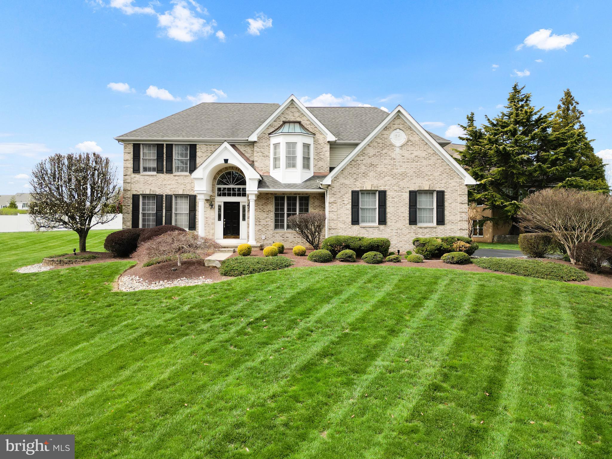 (Open House 04/06 12pm-3pm) 
Welcome to this breathtaking 4-bedroom, 2.5-bathroom stone front corner property nestled in the highly sought-after Northampton Crossing community. 
This colonial center hall has been freshly spruced up and ready to impress. Step inside to the grand 2-story foyer that sets the stage for elegance at every turn.
The formal living and dining rooms flank either side, perfect for hosting soirées or family gatherings. Gleaming hardwood floors lead you to the heart of the home—the spacious family room, where soaring ceilings and expansive windows let in abundant natural light, creating a dramatic and inviting atmosphere. A stunning marble wood-burning fireplace adds warmth and charm to this impressive space. Adjacent to the family room, you'll find a private office/den—perfect for remote work or a quiet retreat. The sparkling white kitchen has just been tastefully updated with brand-new countertops and a gorgeous herringbone backsplash, making it both stylish and functional. A back stairway off the kitchen provides convenient access to the second floor. The home also features a mudroom and laundry room connected to the 2-car garage, offering additional storage and easy living. Upstairs, the spacious master suite is a sanctuary, featuring two walk-in closets, a sitting area, and a spa-like bathroom with pristine white fixtures. Three more generously sized bedrooms and a unique hallway bathroom complete the upper level. Downstairs, the expansive unfinished basement is just waiting for your personal touch, while the brand-new HVAC system ensures comfort year-round. Step outside to the expansive backyard, where endless possibilities for landscaping, outdoor entertaining, or even building your dream oasis await. This home combines the perfect blend of sophistication, functionality, and comfort, all in a highly desirable location. Don’t miss your chance to make it yours!