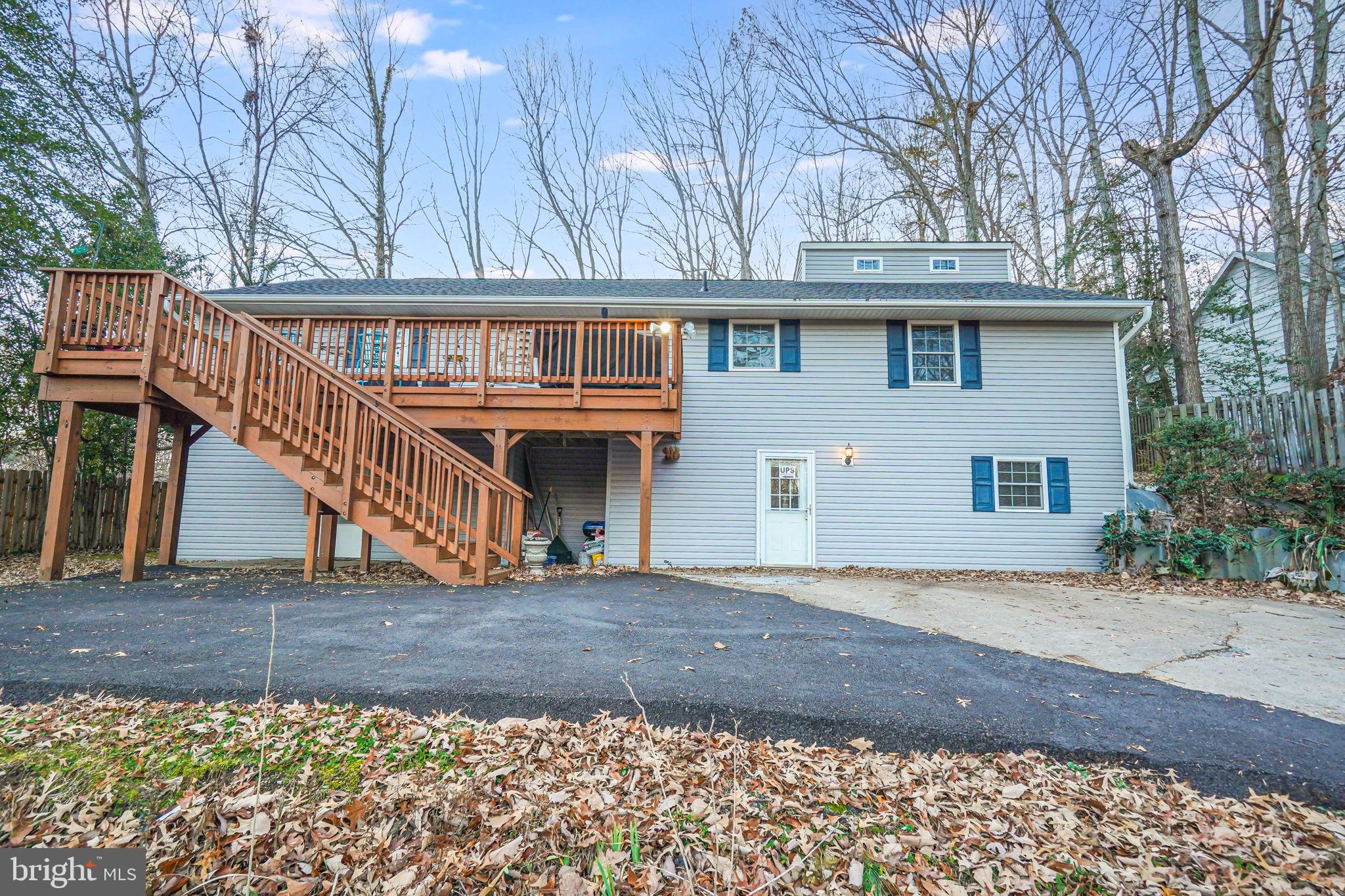 FANTASTIC PRICE for this 5 bedroom 2 1/2 bath home with tons of space!!!  Roof replaced 2023***Partially finished attic connects to large bedroom***Large front deck overlooking large lot***Charming open living room to kitchen with tons of cabinets, side stairs to backyard & large shed with big door/ramp***Propane fireplace will provide tons of heat in lower level which has 2 bedrooms and bath***Located in a fantastic gated community, Aquia Harbour offers an array of amenities, including two pools, a state-certified police force, fire department, marina with boat ramp and fishing pier, kayak/canoe launches, a golf course with a pro shop, putting green, and driving range, along with the renowned Clubhouse at Aquia Harbour Restaurant. Additional community features include a dog park, horse stables, riding areas/trails and pens, a secure storage lot, community garden, preschool, fishing park, and eight other parks with tot lots, tennis, basketball, and abundant wildlife, including bald eagles, foxes, deer, and more!