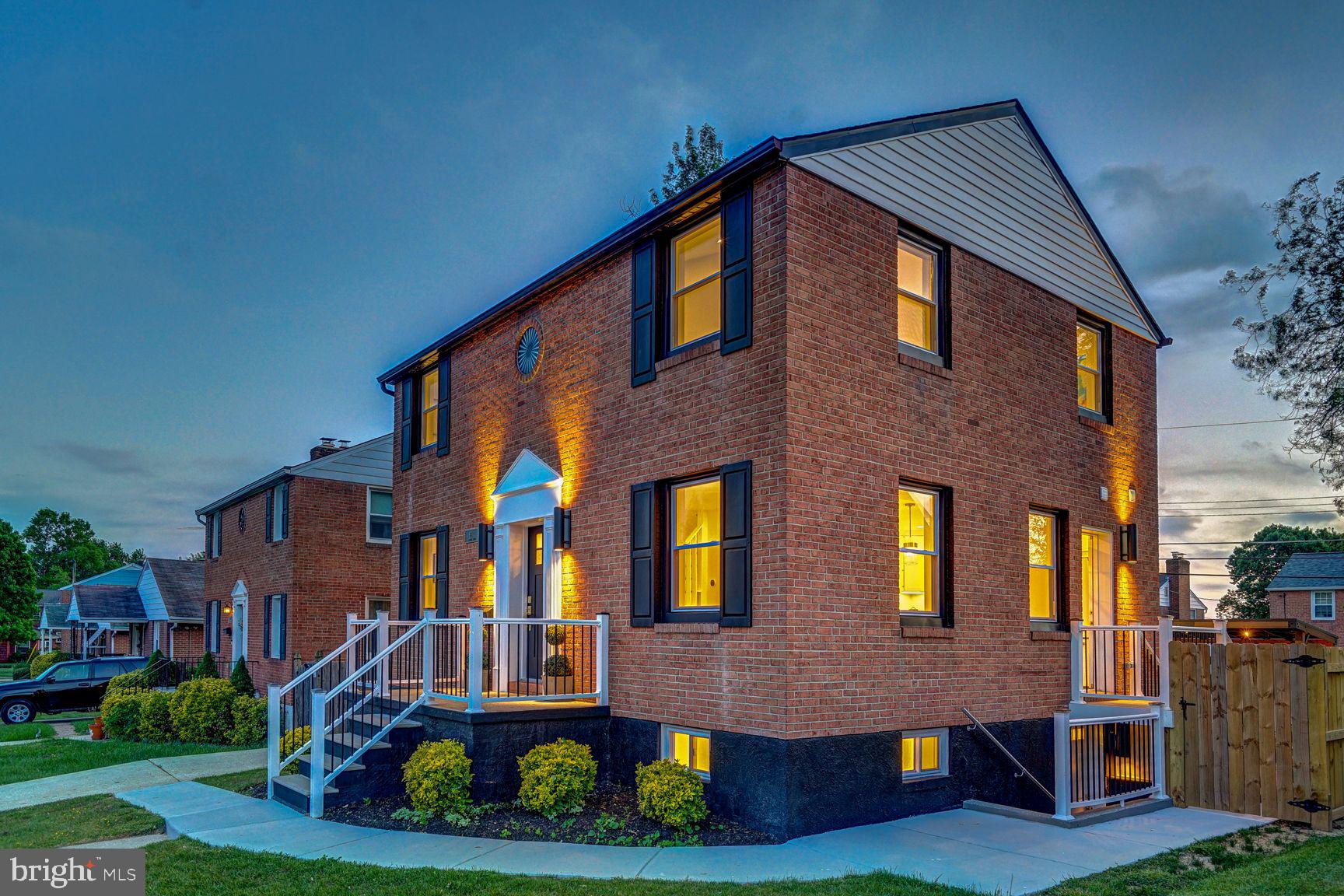 It is quite possibly one of the most beautifully renovated homes in all of Baltimore County—a refined statement of understated classical elegance. This timeless brick colonial is perfectly sited on a square, fully fenced lot in the heart of a desirable residential block, offering exceptional curb appeal and thoughtful design at every turn.
Completely reimagined from the inside out, everything beyond the original brick exterior walls is brand new. The home has been fully gutted to the slab and rebuilt with a meticulously redesigned floor plan that delivers ideal room proportions, seamless flow, and modern functionality. Major system upgrades include all-new plumbing, electrical, and mechanical systems, a new sump pump drainage system, and premium insulation throughout all three levels—including closed-cell foam insulation across the entire roofline for superior energy efficiency.
Upon entry, you are welcomed by a dramatic 28-foot soaring foyer filled with natural light, anchored by a stunning Morison pendant and a custom-designed staircase. The open-concept main level is both elegant and inviting, showcasing designer finishes and high-end materials throughout. The gourmet kitchen features a large island with seating, abundant cabinetry, a full height Silestone backsplash, and GE Café series appliances. The adjacent living room is highlighted by a wood-burning fireplace wrapped in striking 3D tile, while the spacious dining area comfortably accommodates a table for eight and is elevated by a sophisticated Kate Spade chandelier. A magazine-worthy powder room completes the main level.
Upstairs, each bedroom impresses with rare 12-foot ceilings, generous proportions, and custom-organized closets. The expansive owner’s suite offers a luxurious, spa-inspired bath with a double floating vanity, makeup station, and a large, thoughtfully designed walk-in closet.
The fully finished walkout lower level expands the living space with a large recreation room, a bedroom suite with full bath and organized closet, a dedicated laundry room with sink, and additional storage space—ideal for guests or multi-generational living.
Designed with both comfort and entertaining in mind, the home features 87 LED recessed lights on dimmers throughout, complemented by a curated decorative lighting package by Visual Comfort & Company. Premium flooring spans the entire home, reinforcing the sense of quality and cohesion.
The exterior is equally impressive, offering a newly installed concrete patio with a covered grill gazebo, a custom-built storage shed, and a level, square backyard that is fully fenced and gated—perfect for outdoor gatherings or quiet relaxation.
This is a rare opportunity to own a truly turnkey home where every detail has been thoughtfully executed and every box is checked. A standout offering in its price range—this is the home you’ve been waiting for.