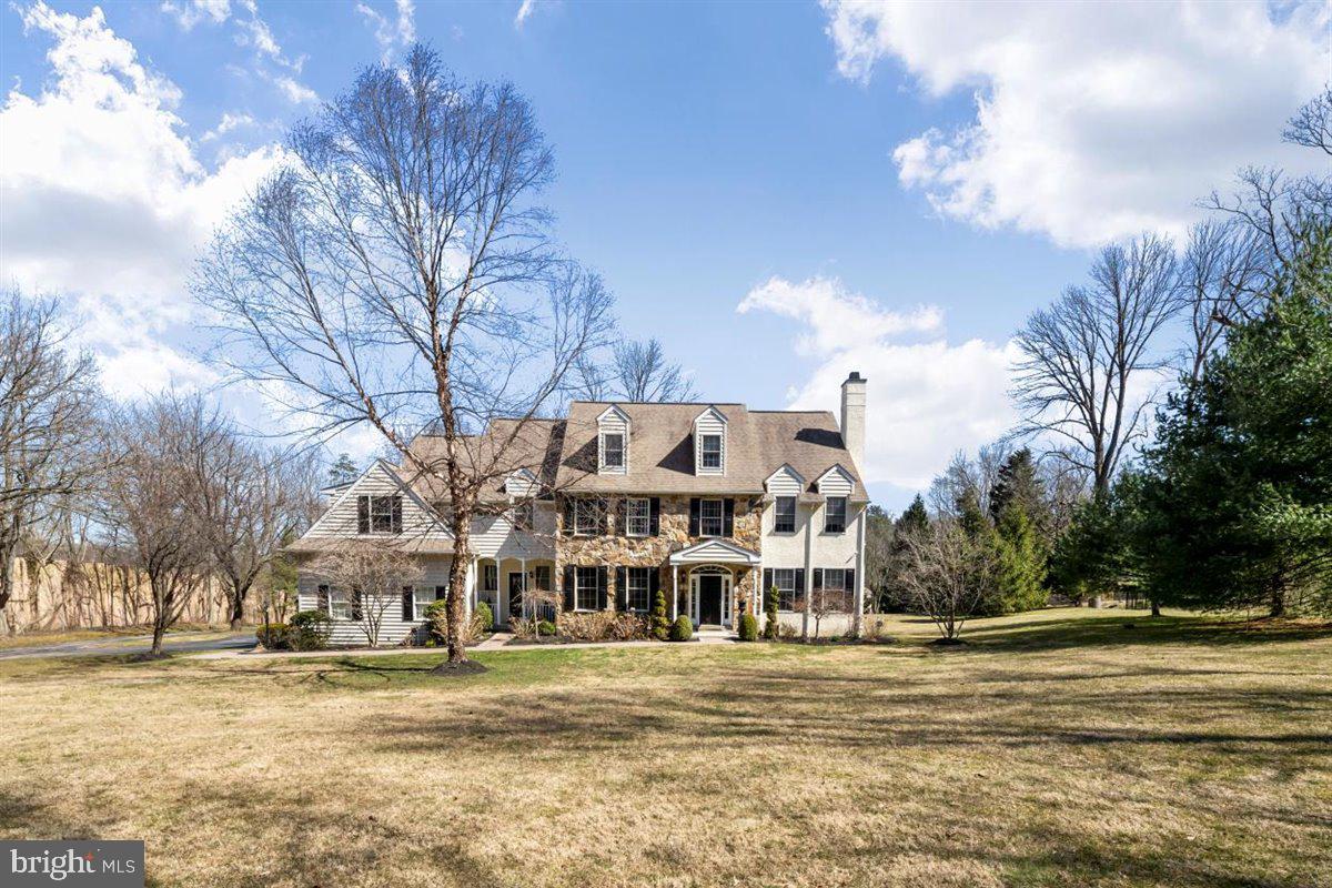 Enjoy the finest quality of living in this magnificent 5 bedroom, 4.5 bath home in highly desirable Lower Merion Twp.  Gorgeous surroundings set on meticulously landscaped grounds, this custom-built home offers spectacular design details with countless upgrades and amenities. Upon entering, you will be impressed by the soaring 2-story reception hall and sweeping staircase. No details were spared in the interior design of this home which boasts new hardwood floors throughout, designer quality wallpaper, high-end chandeliers throughout, wainscoting, crown molding, new hardwood blinds, new carpet in the great room and stair runner and so much more. The first floor offers a flexible flow floor plan from the formal living room with fireplace and attached den, dining room with custom barn door accent, and open kitchen/family room perfect for entertaining and comfortable living space.  The kitchen has been upgraded with new custom cabinets, granite countertops, and a new backsplash which also features a double oven, high-end appliances, and a separate bar area that flows nicely into the heart of the home, the family room, with a converted gas fireplace.  Take the french doors from the kitchen to the back deck and new lower-level large stamped concrete patio.  The lush grounds of the back yard create perfect space for entertaining, private relaxation and there’s even room for a pool!  A newly designed mudroom with benches and hooks and two updated powder rooms round out this floor.  Ascend the gorgeous staircase to the second floor which is dedicated to all the bedrooms – 4 with en-suite baths giving lots of private space and room to have guests.  The expansive main suite is large enough for a separate lounging area and has two custom closets, an en-suite with double vanity, a walk-in shower, and a whirlpool tub.  The third floor has been refinished to use as a 500 sq. ft. office, den, or playroom – a great bonus space for much-needed flexibility to use as needed. Other features of this home are newly painted exterior doors and shutters and an upgraded security system with exterior cameras.  The extensive upgrades and fine details of this home make for gracious and sophisticated living and entertaining.  Wonderful location in Villanova, close to the 476, shopping and great schools.  This is one you won’t want to miss out on.