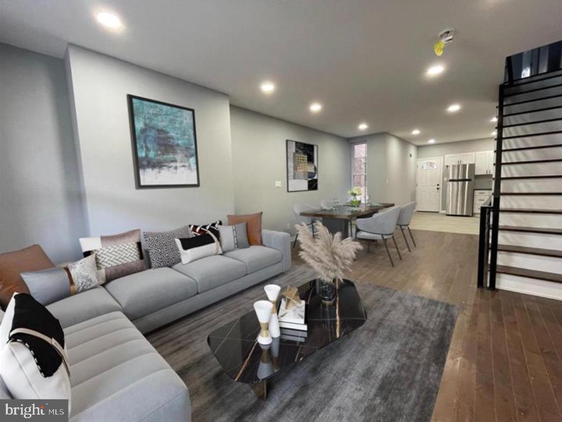 Nestled in the heart of the vibrant Kingsessing neighborhood, this beautifully renovated interior row townhouse offers a perfect blend of modern luxury and classic charm. With a major renovation completed in 2022, this home has been thoughtfully designed to provide an exclusive lifestyle that prioritizes comfort and sophistication. As you step inside, you are greeted by an inviting open layout that seamlessly connects the living and dining areas, adorned with stunning luxury vinyl plank flooring that exudes warmth and elegance. The spacious living room is perfect for both relaxation and entertaining, featuring ample natural light that creates a welcoming atmosphere. The heart of the home is undoubtedly the gourmet kitchen, where culinary dreams come to life. Equipped with high-end appliances and sleek finishes, this space is designed for both functionality and style. Whether you're preparing a casual meal or hosting a dinner party, the kitchen's layout ensures that every gathering is a memorable experience. This residence boasts three generously sized bedrooms, each offering a serene retreat for rest and rejuvenation. The full bathroom has been meticulously updated, showcasing modern fixtures and a soothing color palette that enhances the overall sense of tranquility throughout the home. The unfinished basement presents a blank canvas, offering endless possibilities for customization-be it a home gym, workshop, or additional storage space. Outside, the property features a low-maintenance lot, allowing you to spend more time enjoying the comforts of home and less time on upkeep. Parking is convenient with on-street options readily available, making it easy for you and your guests to come and go. The Kingsessing neighborhood is known for its community spirit and accessibility, providing a vibrant backdrop for your new lifestyle. This property is not just a house; it's a place to create lasting memories. With its luxurious renovations and inviting ambiance, it's ready to welcome you home. Experience the perfect blend of modern living and classic charm in this exceptional residence. Don't miss the opportunity to make this exquisite property your own.