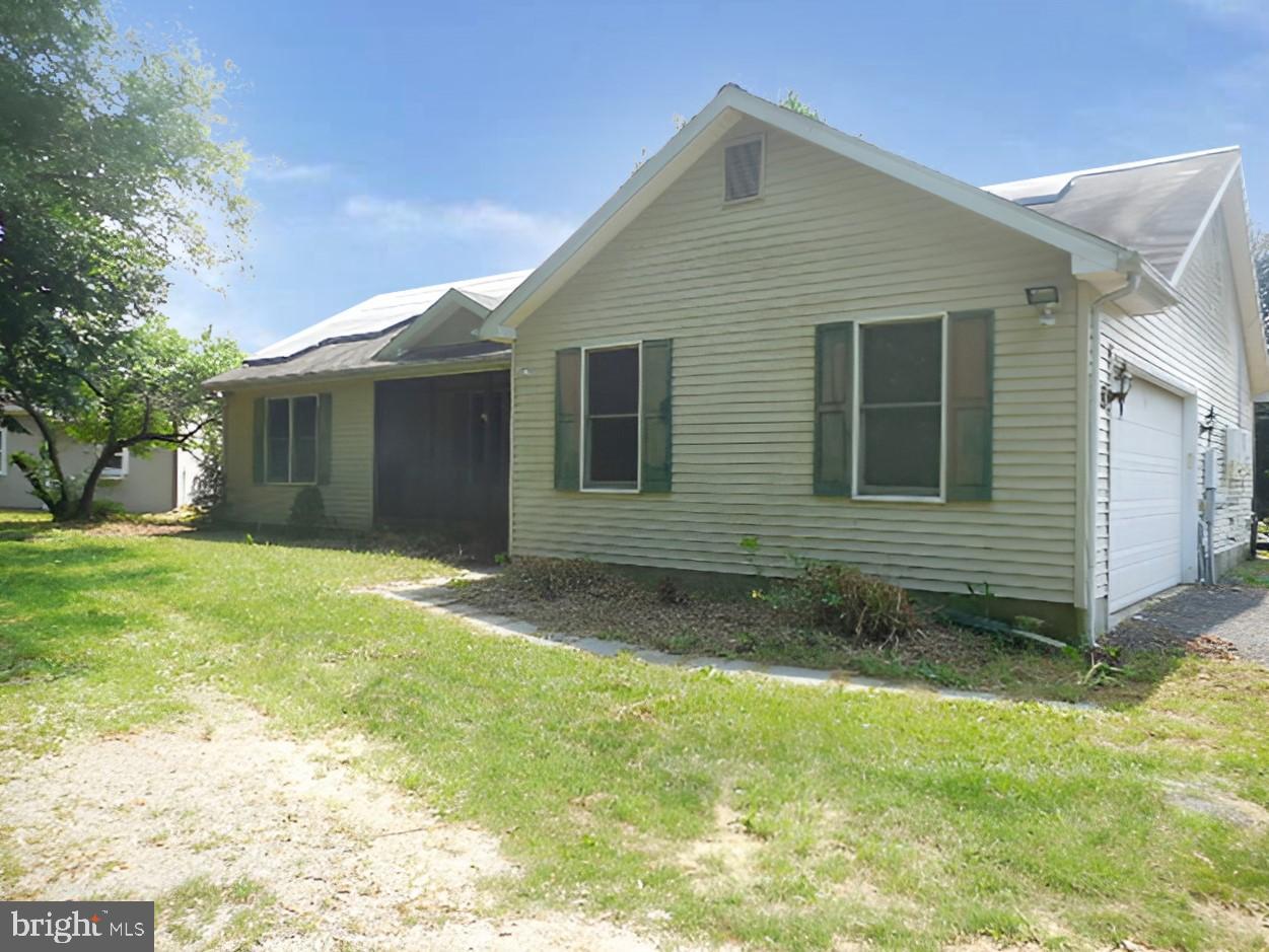 This ranch style home sits on 4.8 acres in a cul-de-sac surrounded by gentleman farms, offering genuine rural character with practical equestrian infrastructure. The property includes a 4 stall stable with wash stall and tack room, plus 4 paddocks with post and board wood fencing, making it well-suited for those seeking a working property. Three bedrooms and two bathrooms provide the core living space.
Inside, the kitchen features granite countertops and stainless steel appliances, while recessed lighting  offers functional illumination. A gravel driveway leads to a side entry garage with inside access, providing convenient vehicle storage and entry. The layout and lot size present genuine opportunity for those looking to establish a rural residence or small equestrian operation. The property's bones and location on substantial acreage are its strongest assets, with room to develop the property according to your vision and needs.