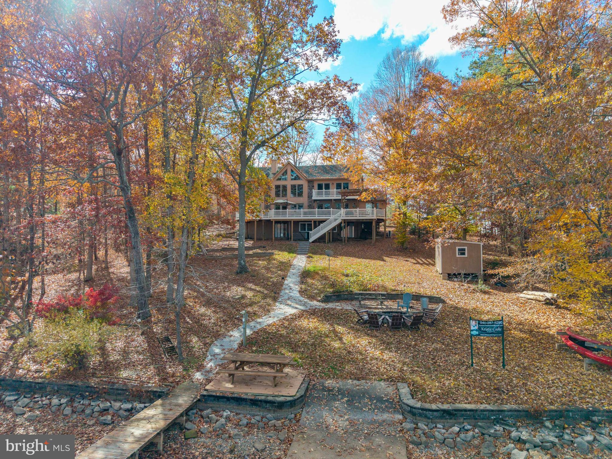 Beautiful and unique Post & Beam home featuring 5 bedrooms and 4 1/2 bathrooms, large PRIVATE DOCK and private swimming area, 8-person Hot Springs HOT TUB, FIRE PIT TERRACE situated in a prime location on Lake Anna with easy lake and road access to many restaurants, breweries, wineries, marinas, state park hiking trails, kids activities, parks, etc. 
The home features unique exposed post & beam cedar construction, a spacious, open floor plan with large windows overlooking the lake providing abundant natural light and views.  Available fully furnished with stocked kitchen. 
The upper level includes landing/loft area open to lake views below, 3 Bedrooms and 2 Full Bathrooms (One Master Suite with En-Suite Bathroom and two Bedrooms sharing another Bathroom). The lower level is NEWLY FINISHED and fully renovated with a Rec Room space with TV, tiled Bathroom, and Bedroom with a new Queen bed.
Both the main and lower level lead out to large outdoor spaces which are a convenient ways to enjoy the views and lake. 
NEW upper rear deck!
Active vacation rental, 2026 bookings can be transferred to new owner.  Wonderful opportunity for either  primary, second or vacation home.
