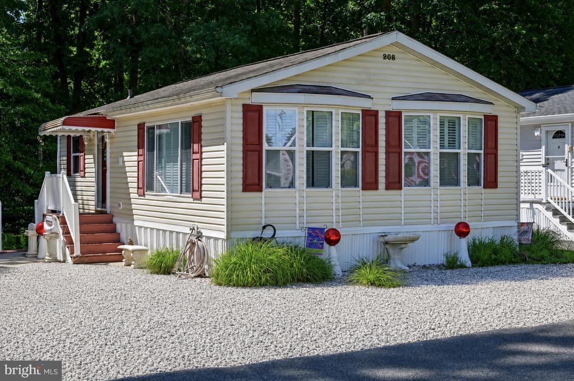 BRING THE BOAT! This is one of the best beach house values in the resort area!!
Don’t miss this opportunity to own a 2-bedroom beach cottage in the amenity-rich, water-oriented community of White Horse Park!  Located just about 10 minutes from the Ocean City beaches or West OC. The home sits on a prime, desirable location backing to trees, offering added privacy with no one behind you.  This is not a ground rent property—it’s a fee-simple deeded lot.  The cottage is fully furnished, tastefully decorated, and move-in ready, making it a true turnkey getaway for family and friends.  Features vaulted ceilings, bay windows in the kitchen and living room, breakfast bar in the kitchen and a very open and spacious layout.  Recent updates and features include a newer refrigerator with ice maker, dishwasher, disposal, plantation shutters, and central heat and air.  Outside, you’ll find a nice rear deck, driveway/patio area, and a storage shed with electric.  Features two bedrooms and full bath inside the home, plus stack washer/dryer.  This community has a bathhouse, showers, community pool and laundromat, which are are just a short walk away.  White Horse Park is a gated waterfront community with 24-hour security and an impressive list of amenities.  Includes a private marina, outdoor pool, boat ramp, boat slips, jet ski slips, kayak and canoe storage, boat/trailer storage lot, basketball court, playground, and crabbing gazebo.  Whether you're an avid boater or just want to enjoy the water lifestyle, this is one of the most affordable ways to do it in the area.  You’re also just minutes from Ocean City, West OC, Assateague Island National Seashore, golf courses, casino, plenty of shopping, great restaurants, and nightlife.  Homes like this—with a deeded lot and this level of amenities at this price point—don’t come along often. Schedule your showing today before it’s gone.