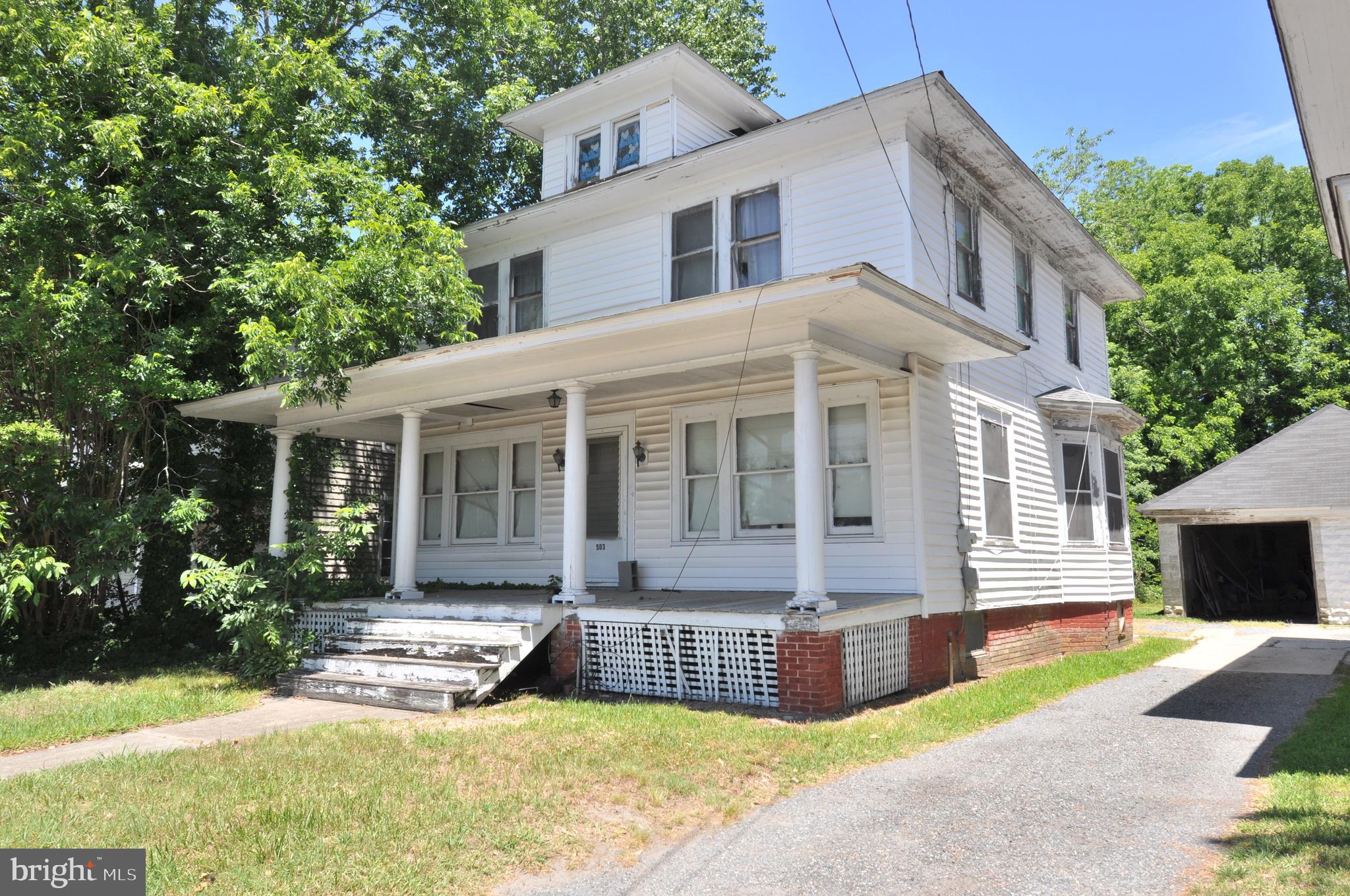 4 BEDROOMS AND 2 BATHS. THE HOME HAS ALL OF THE ORIGINAL UNPAINTED WOOD TRIM AND INTERIOR DOORS.  ALL OF THE ORIGINAL CHARM.  WALK UP STAIRS TO ATTIC. PARTIAL BASEMENT ( DO NOT ENTER). EXTERIOR IS  VINYL SIDING. THE DRIVEWAY IS SHARED WITH PLENTY OF PARKING IN THE LARGE BACK YARD. THE DETACHED GARAGE HAS A COMMON WALL WITH ONE SIDE INCLUDED WITH THIS HOME.       YOU AND YOUR AGENT MUST SIGN THE---- RELEASE AND HOLD HARMLESS AGREENENT---- BEFORE ENTERING THE PROPERTY. THERE APPEARS TO BE A STRUCTURAL ISSUE WIT A PORTION OF THE FIRST FLOOR. MOST OF THE PERSONAL PROPERTY IS INCLUDED WITH THE HOME.