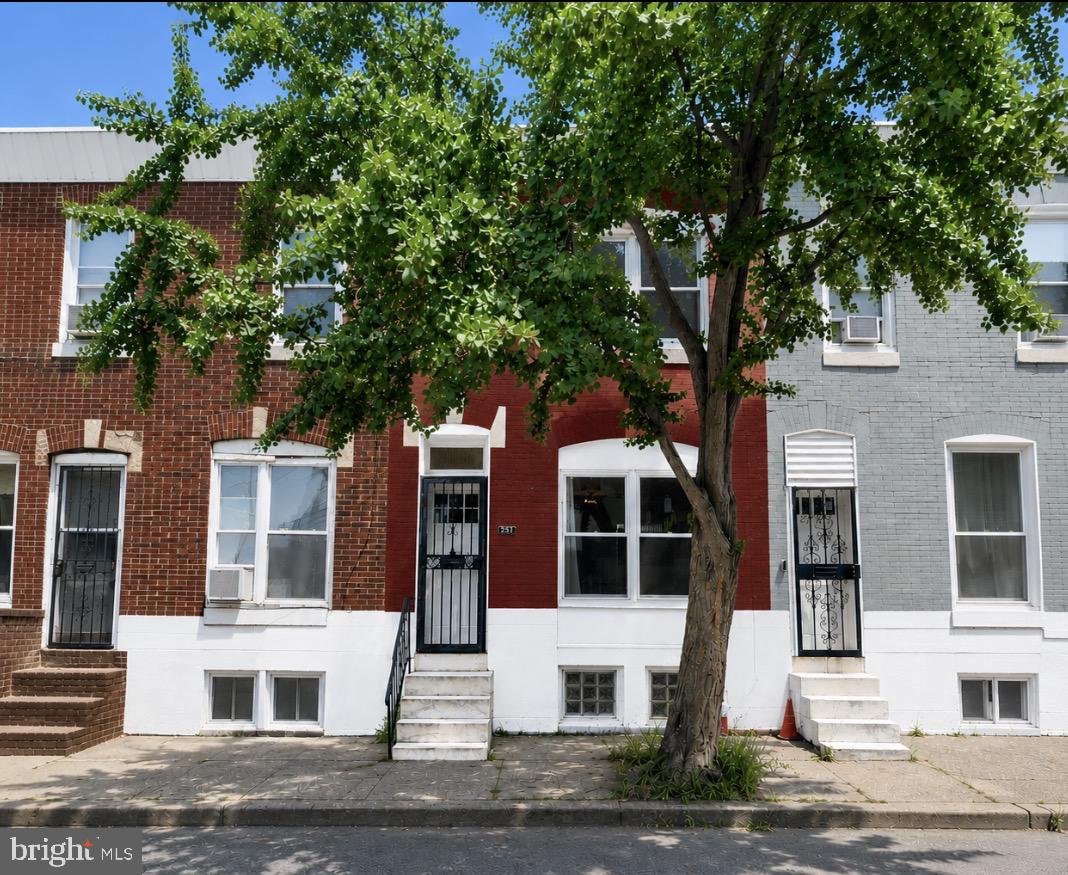 Welcome to this beautifully updated 2-bedroom, 1-bath brick townhouse located on a quiet block in the heart of Grays Ferry. Built in 1920, this home seamlessly blends classic character with many modern upgrades, offering the perfect balance of charm, comfort, and convenience.  Step inside to an inviting open-concept main level featuring brand-new luxury flooring, fresh paint throughout, and an abundance of natural light from the newly installed oversized front windows. The spacious living room flows seamlessly into the updated eat-in kitchen, complete with stainless steel appliances, renovated in 2023, and a new garbage disposal installed in 2025. Just off the kitchen, enjoy a private rear patio—ideal for relaxing, entertaining, or summer barbecues.  Upstairs, you'll find two generously sized bedrooms featuring brand-new carpeting (2025), new bedroom and closet doors, modern ceiling fans, and updated lighting throughout. The fully renovated bathroom includes a working skylight, filling the space with natural light and creating a bright, inviting atmosphere.  The full basement offers excellent ceiling height and endless possibilities for future finished living space, a home gym, workshop, or additional storage. It also includes a washer and dryer, a new 96% high-efficiency furnace (2024), and a new water heater (2024). Additional major improvements include a new sewer lateral (2020), providing peace of mind for years to come.  Conveniently located just minutes from University City, Center City, Philadelphia International Airport, I-76, and within walking distance to the Grays Ferry Shopping Center and Fresh Grocer, this home offers exceptional accessibility while being tucked away on a peaceful residential street.  With its classic brick exterior, thoughtful renovations, and move-in-ready condition, this home is an outstanding opportunity for first-time homebuyers or investors looking to own a beautifully updated property in one of Philadelphia's rapidly growing neighborhoods. Schedule your private showing today!