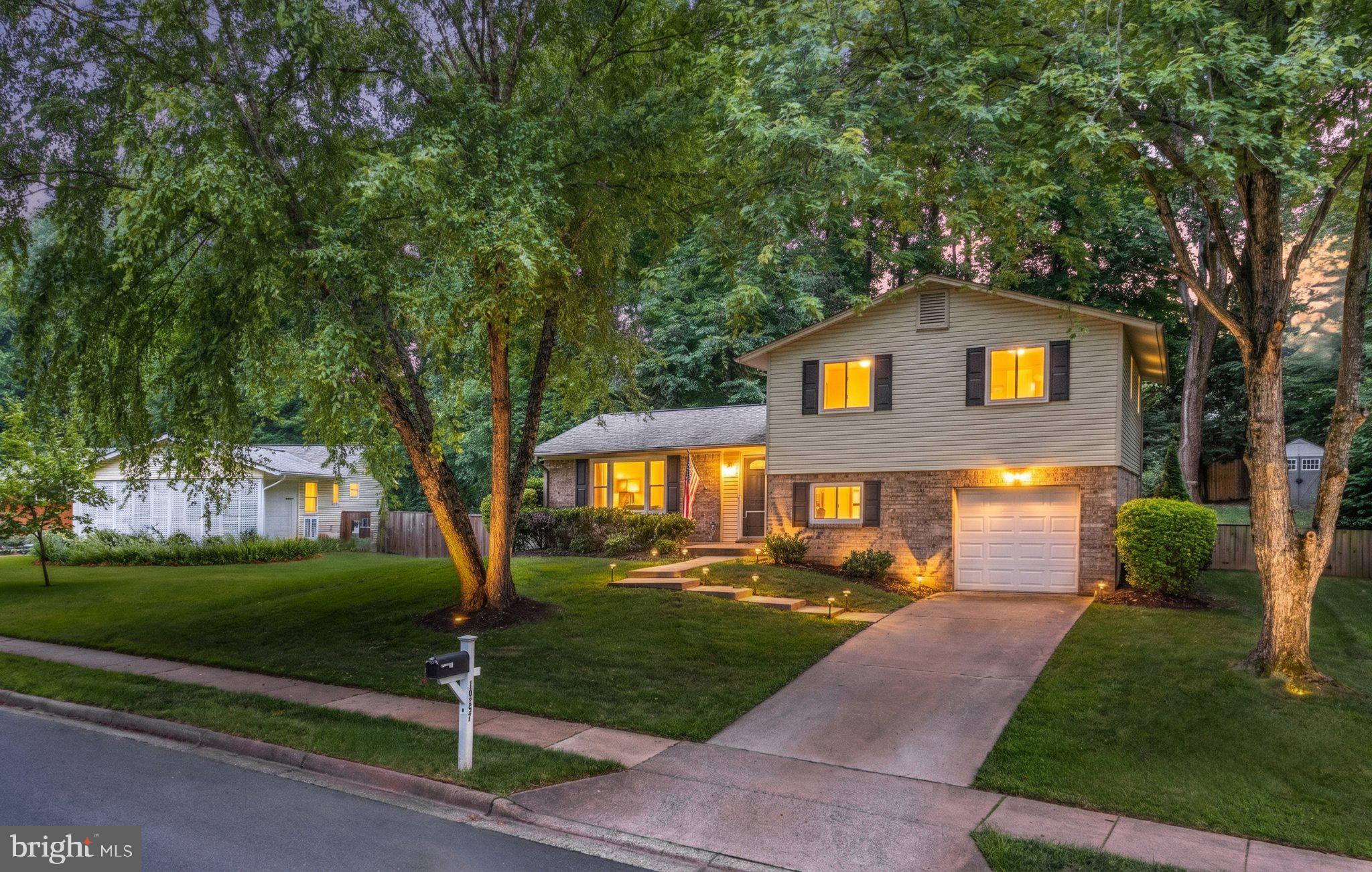 This sophisticated four-bedroom, three-bath home in Kings Park West features an expansive floor plan perfect for modern living. The main level shines with a bright, open-concept layout, luxury vinyl plank flooring, and a gourmet kitchen boasting stainless steel appliances and ample cabinetry. Retreat to the upper level's three spacious bedrooms and two updated designer bathrooms, or utilize the two lower levels which offer a fourth bedroom, a full bath, and two versatile recreation areas.

The outdoor space is a true highlight and rare oasis, featuring a fully fenced backyard with a large stone patio, built-in firepit, professional landscaping, and a substantial storage shed. Major updates provide total peace of mind, including a new furnace, water heater, and humidifier, a newer roof, enhanced insulation, and an EV charger in the garage.

Located in a vibrant community, you'll enjoy access to three pools, a scenic lake with a nature trail, and various sports courts. Commuting is a breeze with nearby Metro bus routes and the VRE, all while being moments away from local shopping and entertainment. Don't miss this GEM of a home in a wonderful neighborhood!