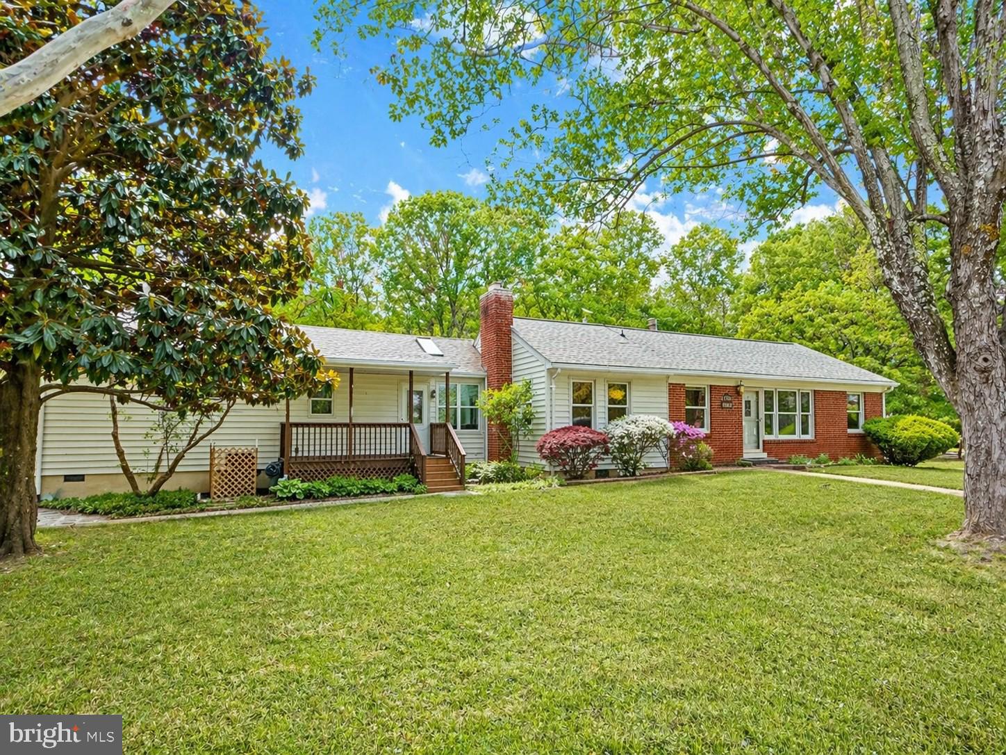 Well-built and thoughtfully updated, this spacious one-level home is nestled on 3.99 private acres and offers a rare combination of functionality, flexibility, and quality construction. The home features a blend of hardwood flooring, luxury vinyl plank, and ceramic tile throughout.

The inviting living room offers a classic layout with a ventless gas log fireplace and custom corner built-in shelving. The kitchen is well-appointed with custom maple cabinetry, Corian countertops, abundant cabinet and counter space, and a center island with bar seating, perfect for everyday dining. A separate formal dining room provides an ideal setting for gatherings and entertaining.

A standout feature of the home is the bright and airy sunroom, complete with a vaulted ceiling, skylights, built-in shelving, and heated ceramic tile flooring, creating a comfortable space to enjoy year-round natural light.

The main level includes a spacious primary bedroom with a walk-in closet and attached half bath, along with a full hall bathroom. A mudroom/laundry area with built-ins and shelving adds convenience and functionality, especially for those coming in from outdoor activities or gardening.

An attached in-law suite provides a fully separate living space, featuring its own living room, kitchenette, bedroom, and full bathroom—ideal for multi-generational living, guests, or potential rental use.

Additional upgrades include Trane HVAC systems servicing both the main home and in-law suite, Marvin Infinity windows, and insulated siding for improved efficiency.

The exterior offers exceptional versatility with multiple outbuildings, including a detached studio/workshop equipped with a mini-split system, ceiling fans, and both 110V and 220V electrical service. A metal shop/barn with 110V electric, a two-car metal carport with attached shed (110V, bay door, and shelving), a one-car enclosed shed with lean-to, as well as a greenhouse, potting shed, potting table, rain barrel, and a large, fenced garden area provide endless opportunities for hobbies, storage, and outdoor living.

Starlink internet is available and will convey with three routers, offering reliable connectivity for remote work or streaming needs.

This unique property combines solid construction, numerous updates, and exceptional outdoor amenities, all in a peaceful setting while still being conveniently located to nearby amenities.