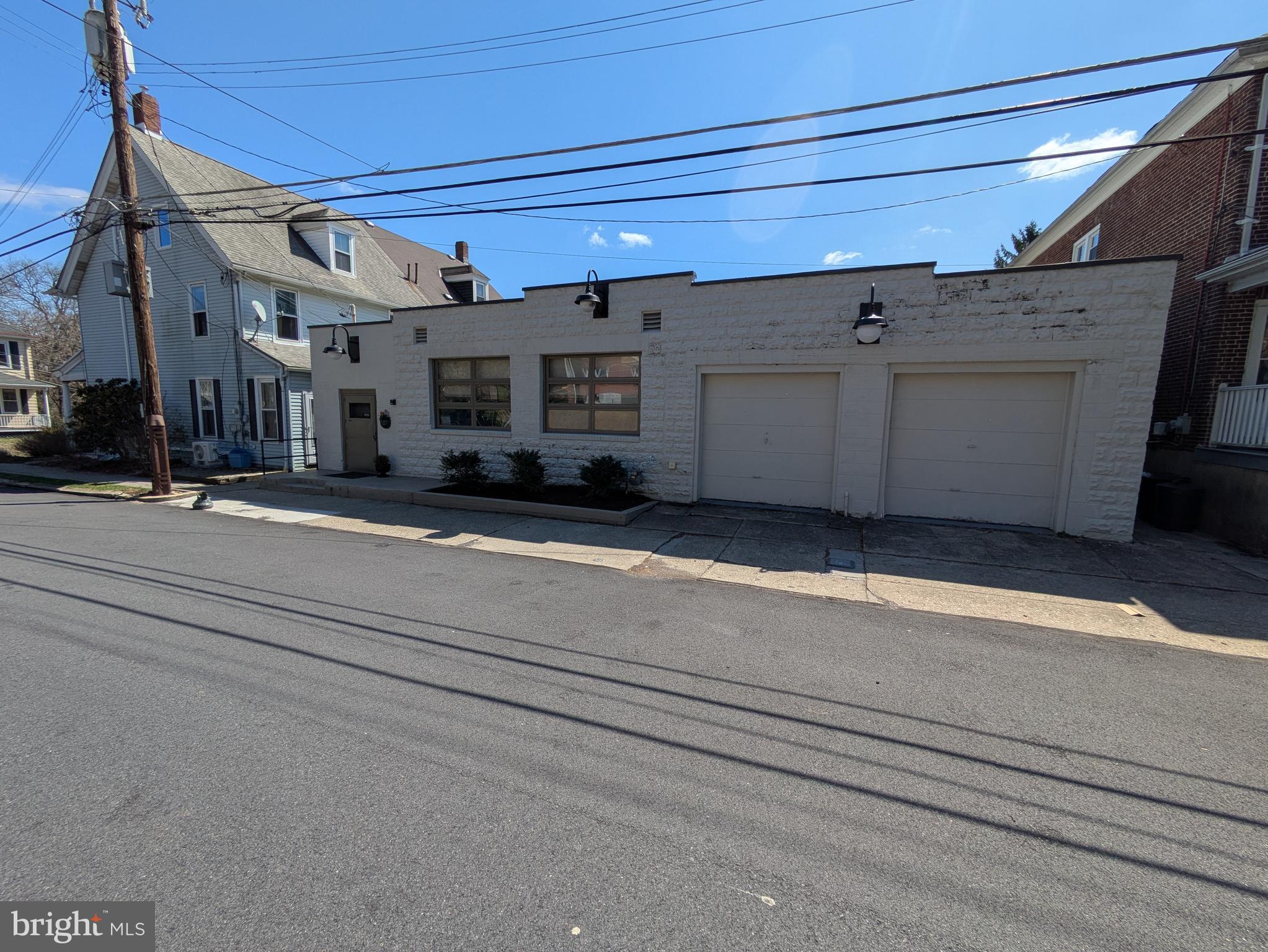 A rare opportunity in College Hill. A solid block business building in a residential neighborhood. Currently used as a warehouse and office space. It offers warmth and charm in it's flexible space. Enter the building through one of the original dairy cooler doors. There are several offices and open conference spaces that can be easily be used for storage, presentation, showroom etc. One garage bay offers easy access (the 2nd bay is finished for office or storage space). Updated gas heat and central a/c. Roof was coated in 2024. Close to Lafayette College, Easton and Route 22 and other major routes.
