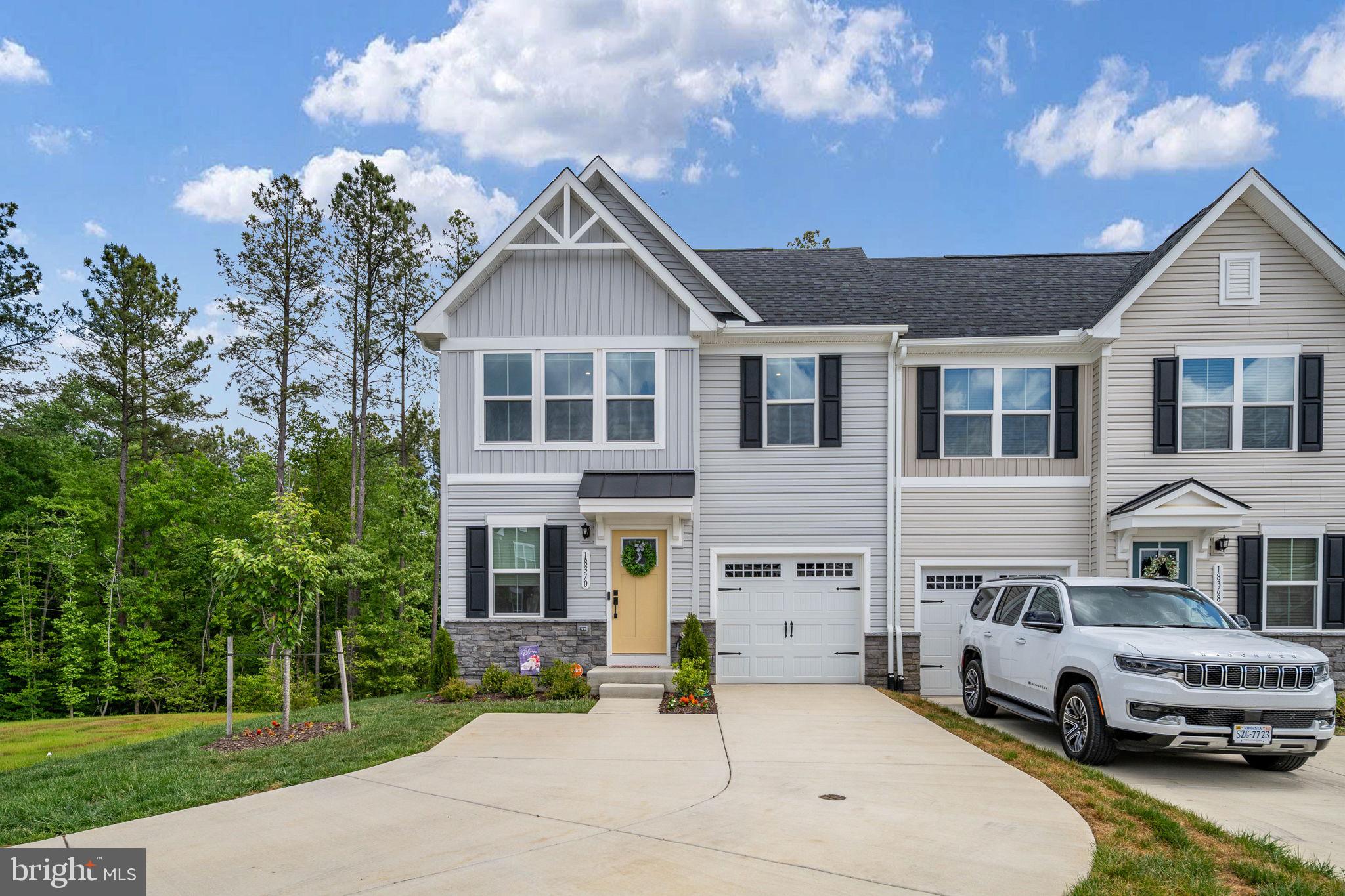 Welcome to a rare opportunity to own an almost brand new end-unit townhome that truly lives like a single-family home.  With 4 bedrooms and 3.5 bathrooms, this thoughtfully designed property offers both space and privacy in a highly desirable setting. This newly built townhome offers the convenience  of new construction with upgrades like custom blinds and a water treatment system.

The main level features convenient one-level living, including a spacious primary suite, and is highlighted by a beautiful covered porch that overlooks peaceful wooded views—with no neighbors on one side creating a sense of seclusion that’s hard to find. Whether you’re enjoying your morning coffee or unwinding in the evening, this outdoor space is a true retreat.

Upstairs, you’ll find two spacious bedrooms, hallway bathroom, along with both finished and unfinished storage spaces—perfect for organization and future flexibility.

The fully finished basement expands your living space with a large rec room, an additional bedroom, and a full bathroom—ideal for guests or multi-generational living. Step outside to the covered patio and continue to enjoy the serene natural backdrop.

What truly sets this home apart is its rare lot, featuring the only extended driveway in this townhome section.

Residents enjoy access to exceptional community amenities, including a pool, golf course, pickleball courts, walking trails, tot lot, dog park, and more—creating a lifestyle that blends relaxation, recreation, and connection.

This is more than a home—it’s a unique opportunity to experience comfort, privacy, and community all in one.