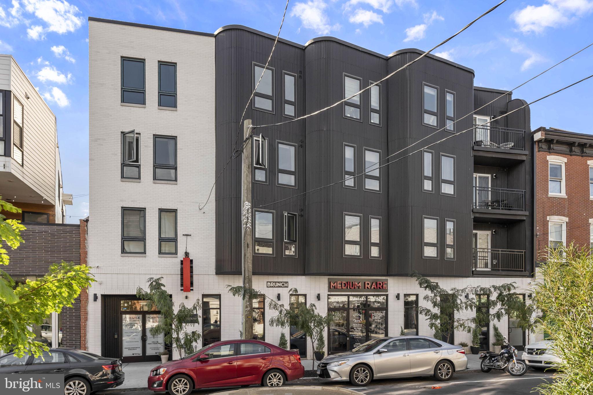 Introducing Fifteen40 Flats a newly constructed luxury boutique condominium in the heart of Fishtown. Enjoy the privacy and security of a gated entrance off vibrant Frankford Avenue and the ease of an ELEVATOR that takes you directly to your penthouse-level home, Unit 4C a spacious 2-BD | 2.5-BA | CORNER RESIDENCE designed for modern living. Step inside to find wide-plank engineered hardwood floors leading you through a bright, open-concept living and dining area bathed in natural light. The European-inspired kitchen features custom contemporary cabinetry, quartz countertops, a sleek tile backsplash, and premium stainless-steel appliances a perfect blend of style and function. A convenient powder room completes this level. Both bedrooms are generously sized and include spa-like en-suite baths with custom tile finishes, while a laundry closet with full-size front-loading washer and dryer adds everyday convenience. Ride the ELEVATOR up ONE floor to the rooftop deck and take in breathtaking city skyline views the perfect spot to relax or entertain. The rooftop also includes a large dog run, and the building offers bike storage for residents. Experience the very best of Fishtown living surrounded by Philadelphia’s top restaurants, cafés, and nightlife. With easy access to SEPTA’s Market-Frankford Line and I-95, you’ll enjoy quick commutes to Center City, University City, the airport, and beyond. Approximately 8 years left on FULL TAX ABATEMENT . Luxury, convenience, and location all waiting for you at Fifteen40 Flats.