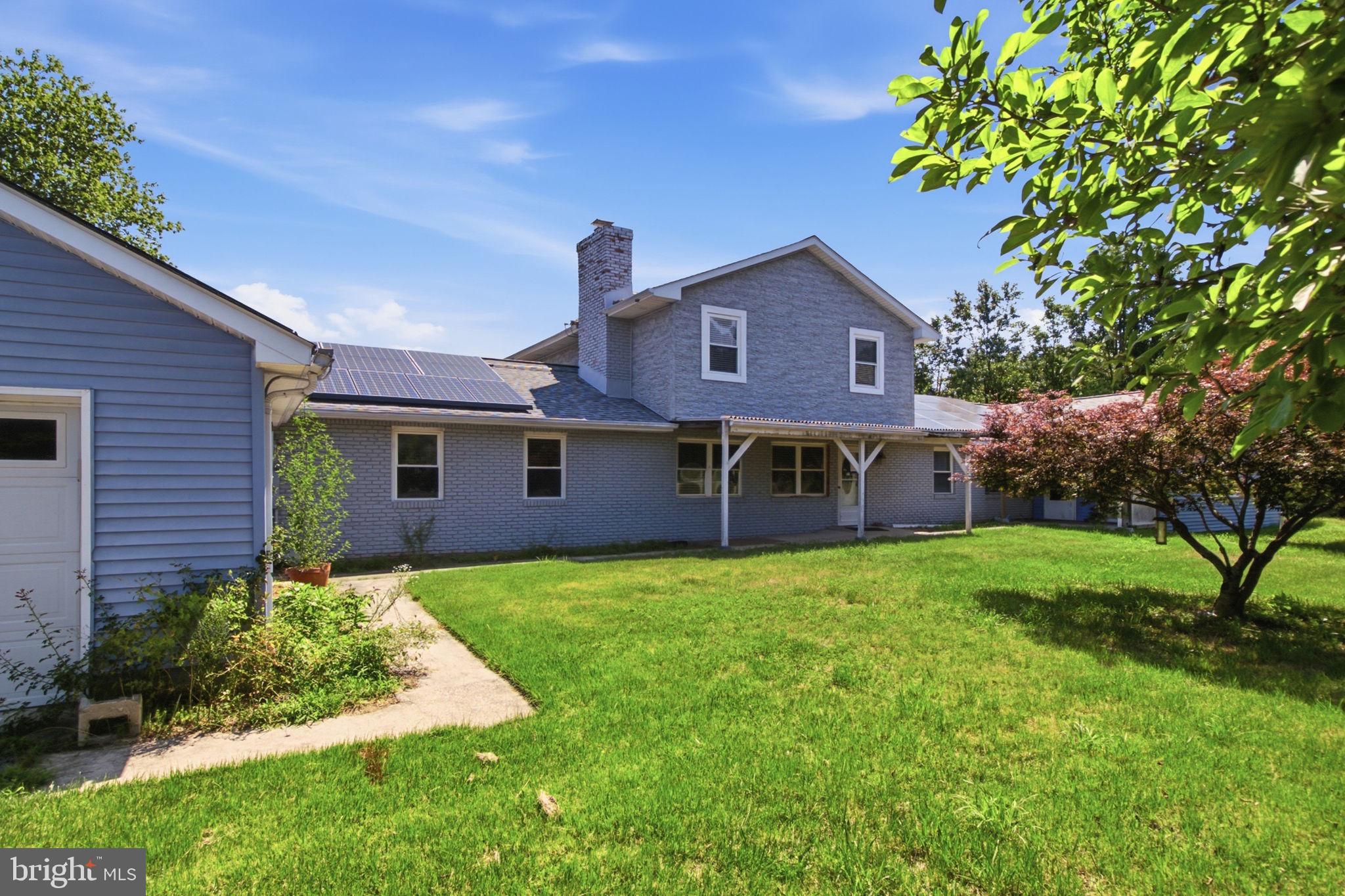Investor Special – Endless Potential! This unique multi-generational property offers an incredible opportunity for investors, renovators, or buyers looking to create substantial value. Situated on a private, tree-lined 1-acre lot in the heart of Owings, this expansive property boasts over 5,800 square feet of combined living and utility space and is being sold strictly AS-IS. The main residence features approximately 3,300 square feet with 3 bedrooms, 2 full bathrooms, a spacious family room with a fireplace, formal dining room, and an oversized kitchen designed for entertaining. Attached to the main home is a 400-square-foot in-law suite complete with 1 bedroom, 1 full bathroom, and a wet bar, making it ideal for extended family, guests, or a private home office. A second attached Accessory Dwelling Unit (ADU) offers approximately 1,300 square feet with 3 bedrooms and 1 full bathroom, its own dedicated parking area, guest parking, and a private fenced backyard, creating outstanding potential for rental income, multi-generational living, or guest accommodations. Additional features include an attached 2-car garage, approximately 500 square feet of unfinished storage/workshop space, two storage sheds, and a fully paved driveway providing ample parking. Recent improvements include new roofs (2022) on the main home and sheds, a new HVAC system (2022) for the main residence, and a 27 kW leased Tesla solar system that helps reduce energy costs. Whether you're looking to renovate and resell, create a multi-generational estate, or maximize the property's income-producing potential, this is a rare opportunity in sought-after Calvert County. Bring your vision and unlock the possibilities! Photos may be virtually staged